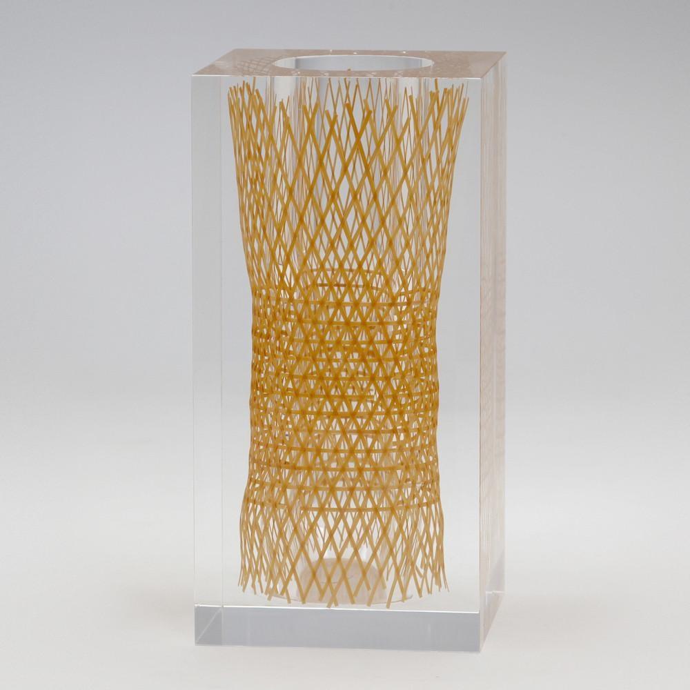 The Beppu bamboo flower vases demonstrate a beautiful juxtaposition of traditional and contemporary production techniques. A woven cylinder of bamboo, made using traditional weaving techniques of the Beppu region of Japan, is perfectly encased in a