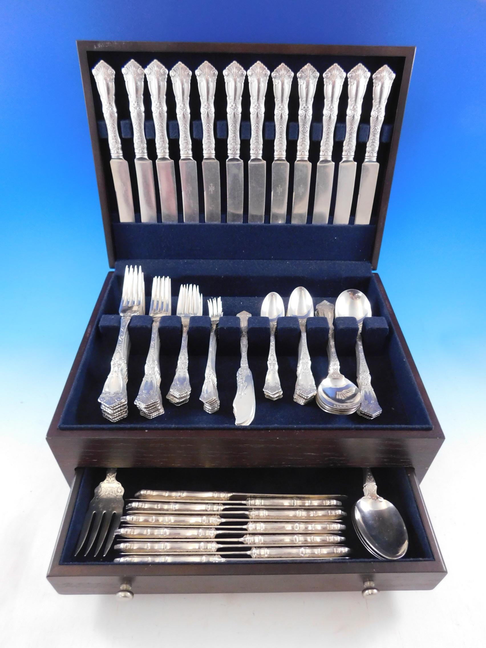 Rare monumental dinner and luncheon size berain by Wallace sterling silver flatware set, 125 pieces. This set includes:

12 dinner size knives, 9 1/2