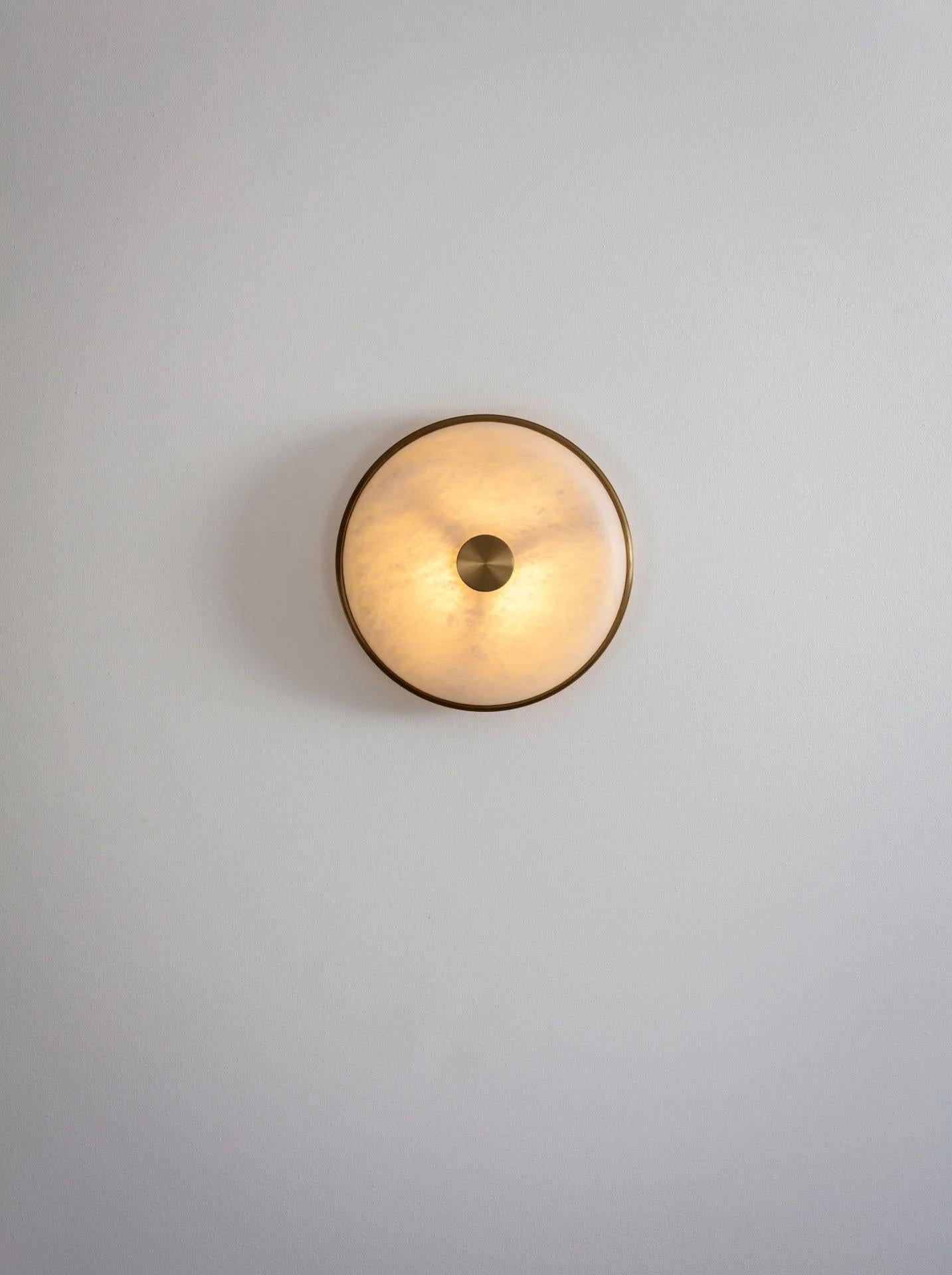 Beran Antique Brass Small Wall Light by Bert Frank
Dimensions: D 6,5 x W 26 x H 26 cm.
Materials: Brass and alabaster.

Available in two different sizes. Available in different finishes and materials. Please contact us. 

Simple and elegant in form,