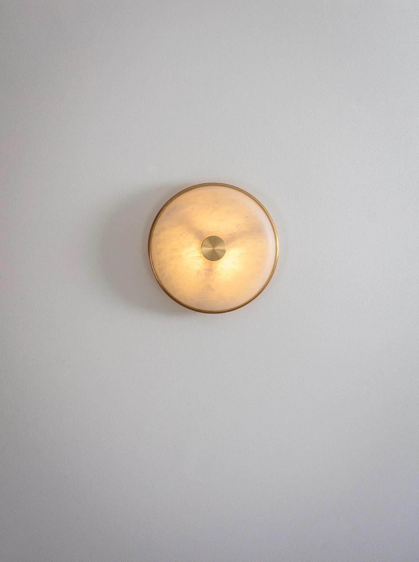 Beran Brushed Brass Small Wall Light by Bert Frank
Dimensions: D 6,5 x W 26 x H 26 cm.
Materials: Brass and alabaster.

Available in two different sizes. Available in different finishes and materials. Please contact us. 

Simple and elegant in form,