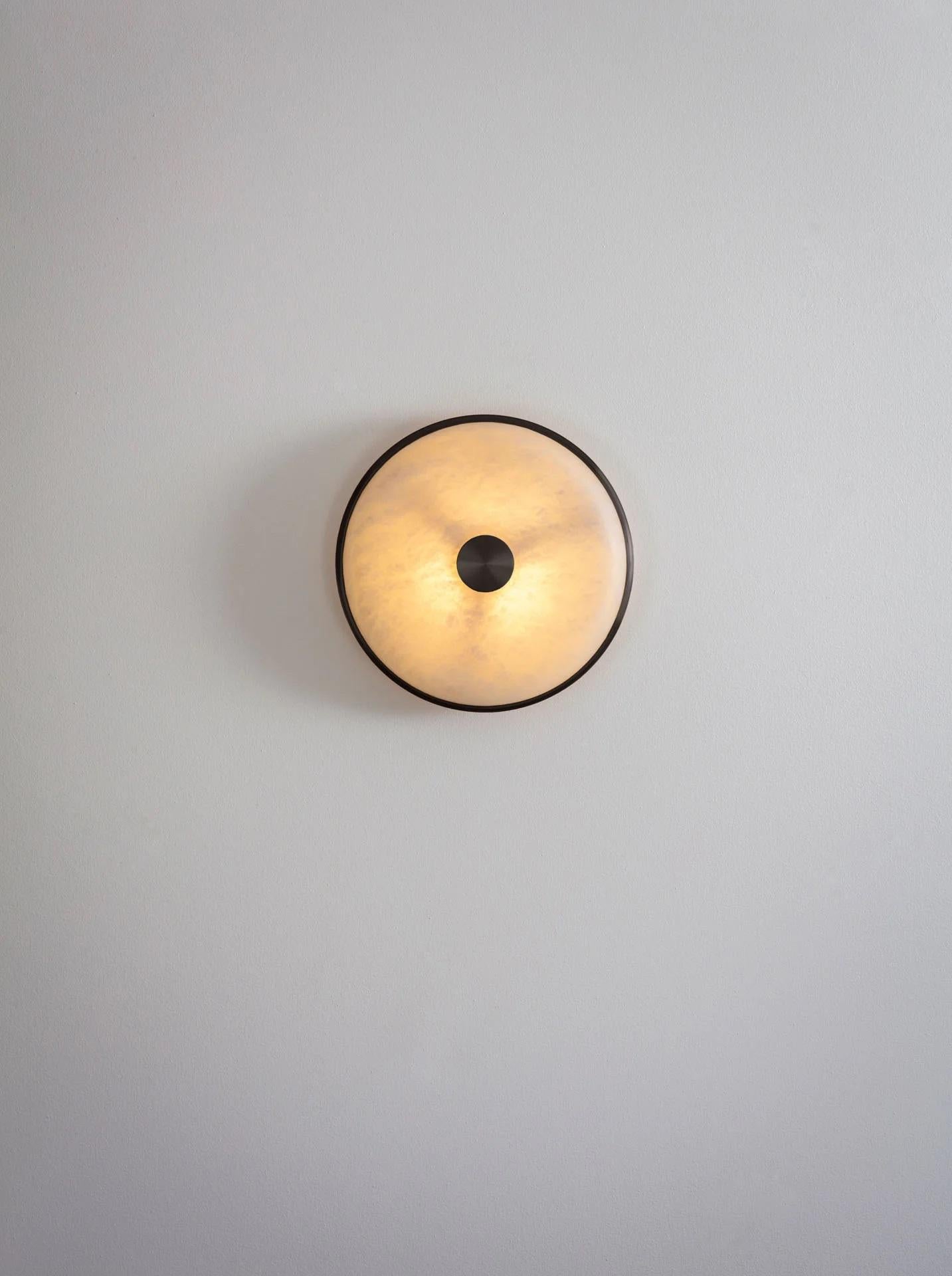 Beran Dark Bronze Small Wall Light by Bert Frank
Dimensions: D 6,5 x W 26 x H 26 cm.
Materials: Bronze and alabaster.

Available in two different sizes. Available in different finishes and materials. Please contact us. 

Simple and elegant in form,