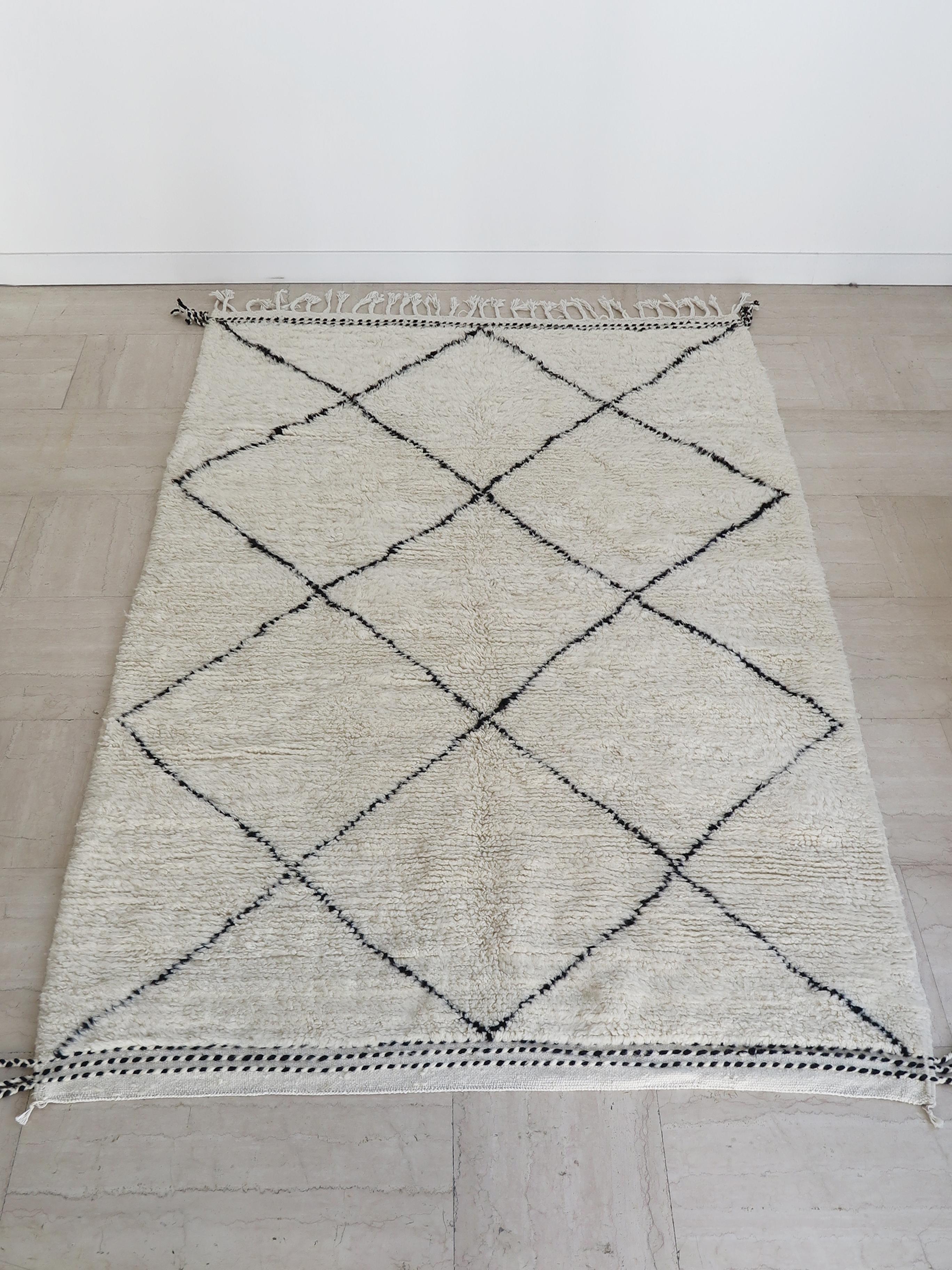 Handmade wool Berber rug carpet with contrasting graphic design,
Morocco production 2000s.