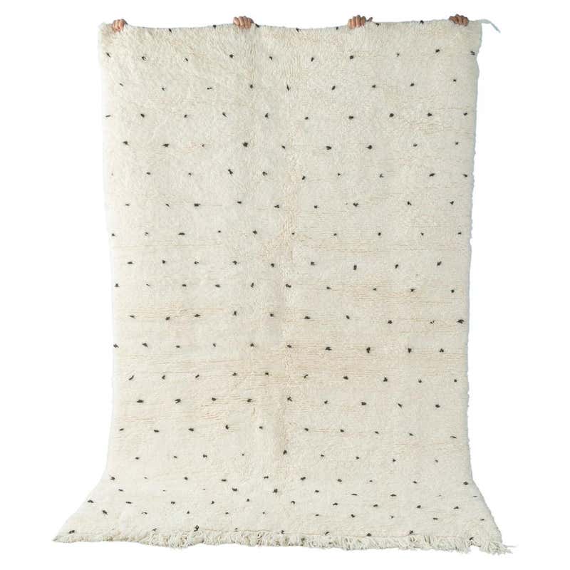 A handmade Morrocan Beni Ourain Berber rug with blue and white stepped ...