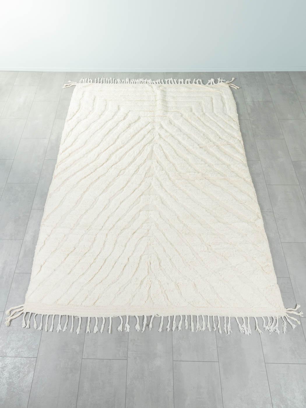 Flowing Water is a contemporary 100% wool rug – thick and soft, comfortable underfoot. Our Berber rugs are handwoven and handknotted by Amazigh women in the Atlas Mountains. These communities have been crafting rugs for thousands of years. One knot