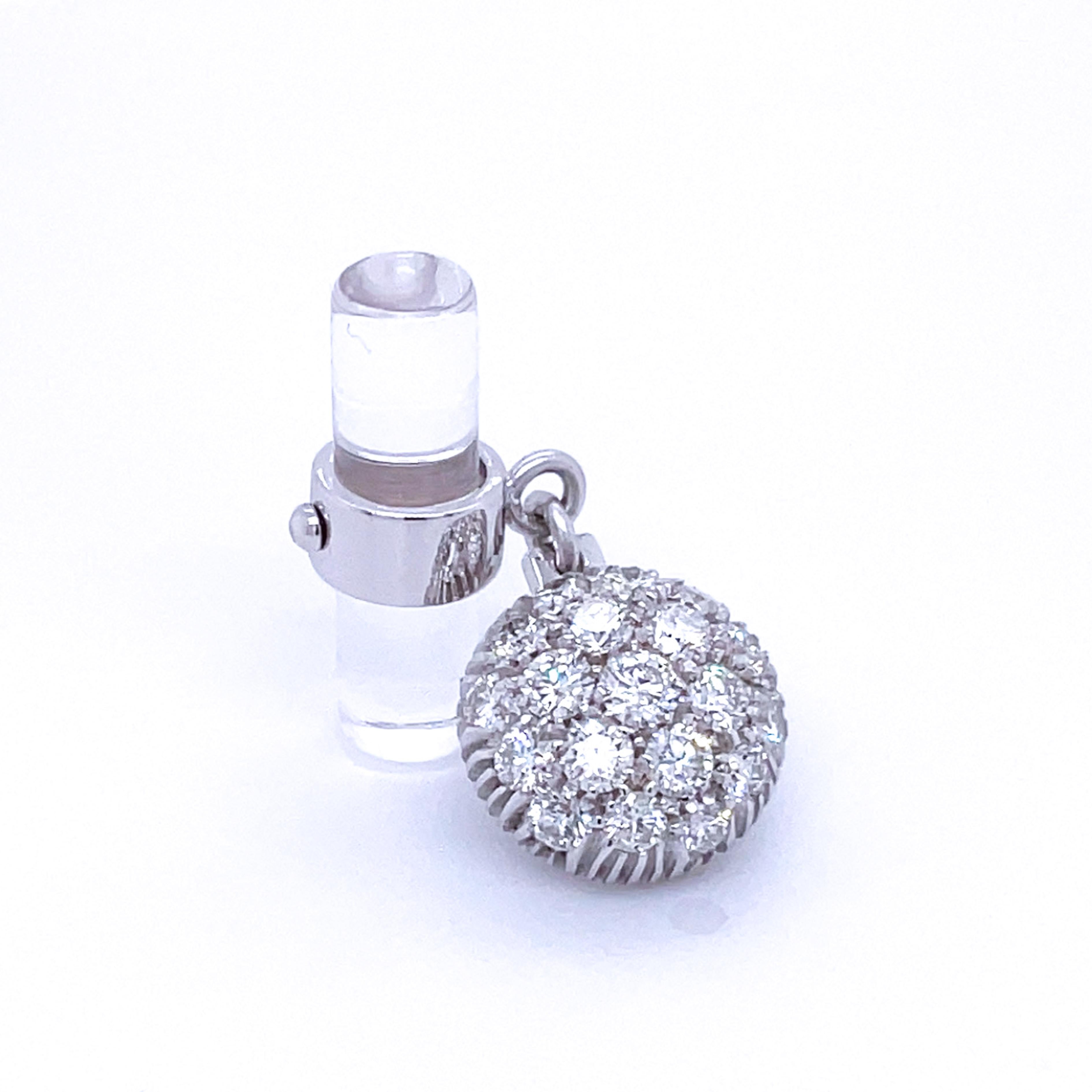Absolutely Chic, Smart yet Timeless 1.81 Carat Top Quality Brilliant Cut White Diamond in a 0.28 OzT 18Kt White Gold Setting, 8.5 Carat Hand Inlaid Rock Crystal Stick Back.
In our fitted tobacco leather case and pouch.
