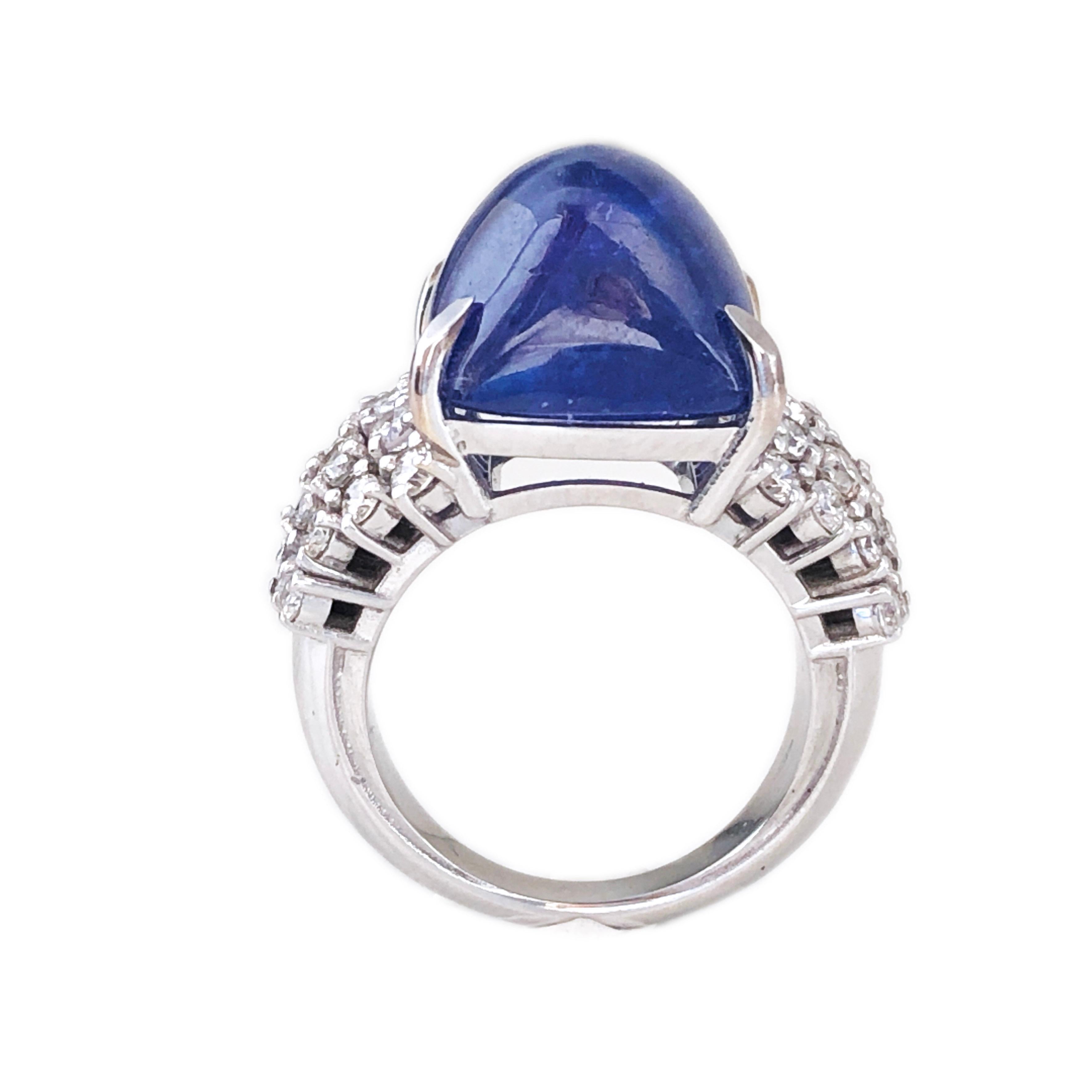 A Beautiful Natural 19.57 Carat Tanzanite Antik Cut Cabochon(about 0.511x0.60inches) in a Suptuous yet Timeless 32 White Diamond(1.61 Carat, G-H, Vvs1) 18k White Gold Setting Cocktail Ring.
A detailed gemological certicate will be included.
In our