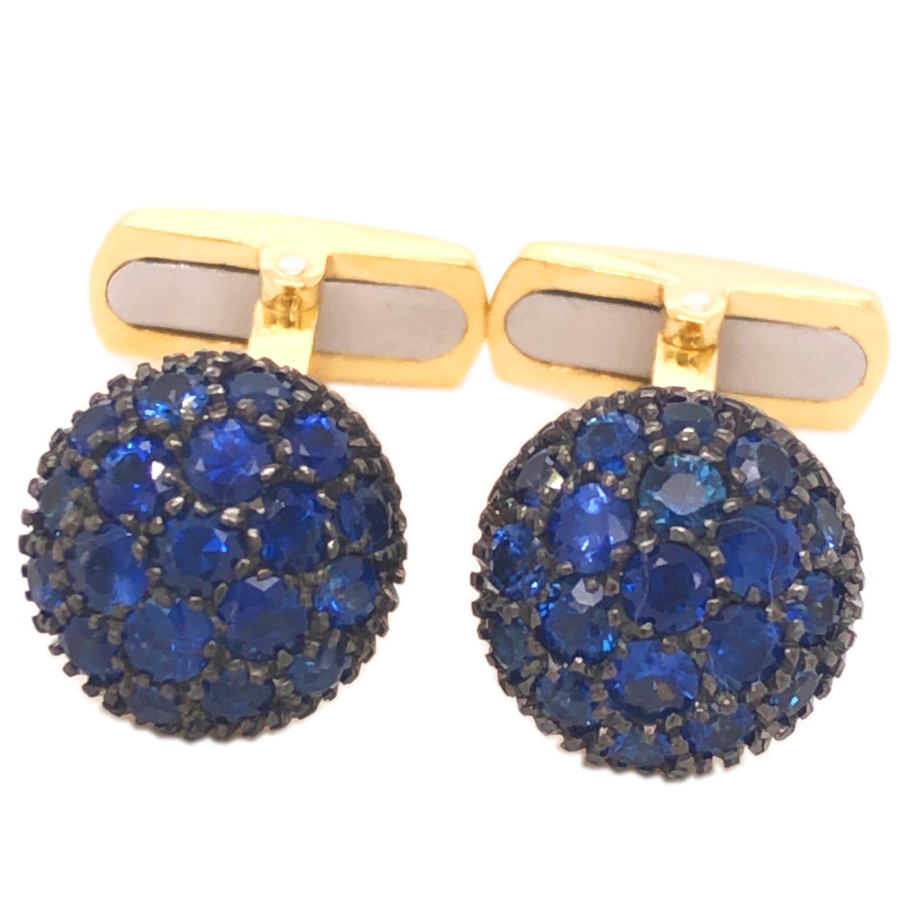 Absolutely Chic, Smart yet Timeless 2.31 Carat Natural Round Blue Brilliant Cut Sapphire in a 0.30 OzT 18Kt Oxidized Black and Yellow Gold Round Cabochon Setting, 
In our gift wrapped fitted tobacco leather case and pouch.
A detailed expertise is