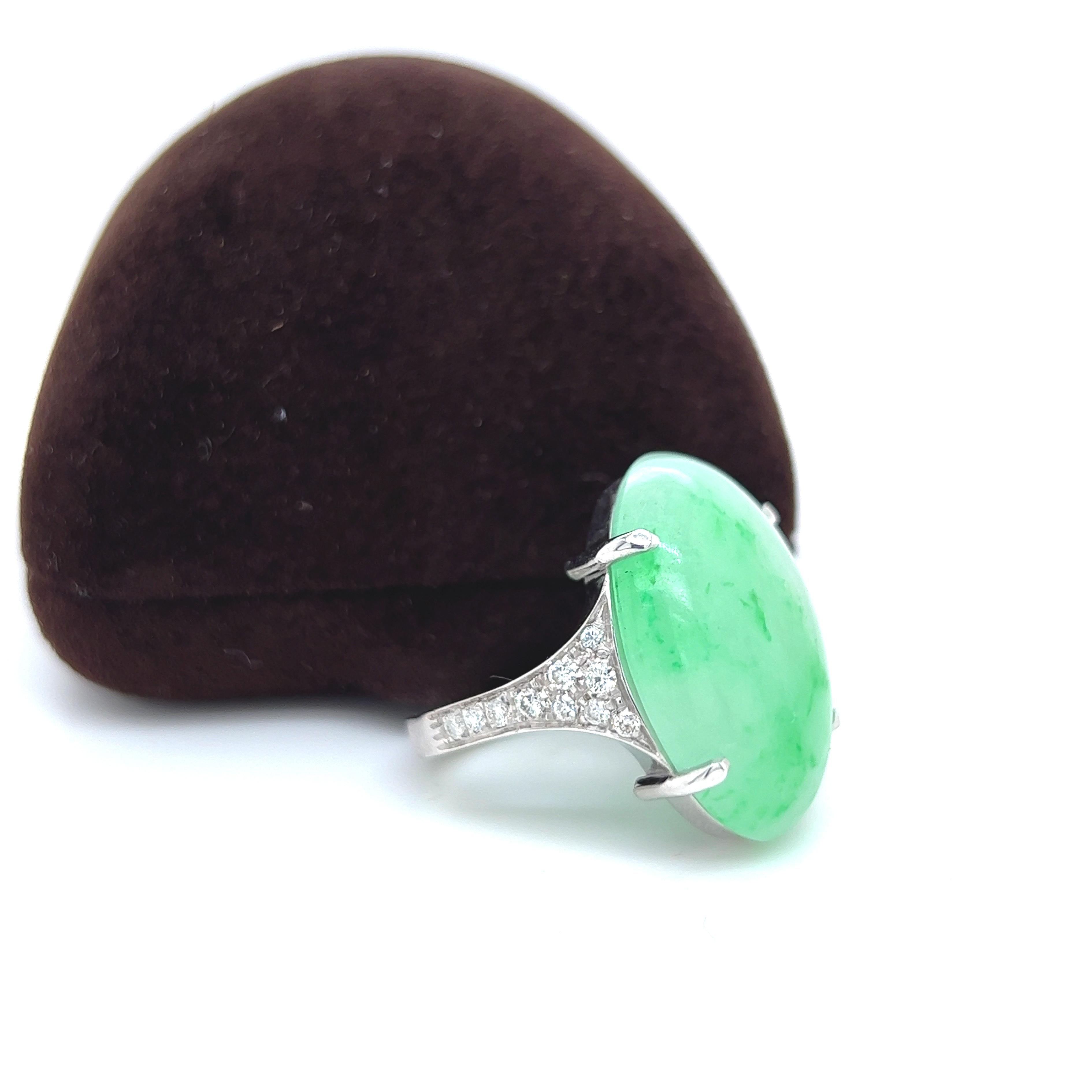 One-of-a-kind, Contemporary, Unique yet Chic Cocktail Ring Featuring a 23.30 Carat Natural Green Jade Cabochon (0.916x0.704in) in a 0.51Kt Top Quality White Diamond Setting.
The color-changing of the Green Jade's cabochon combined with White Diamond