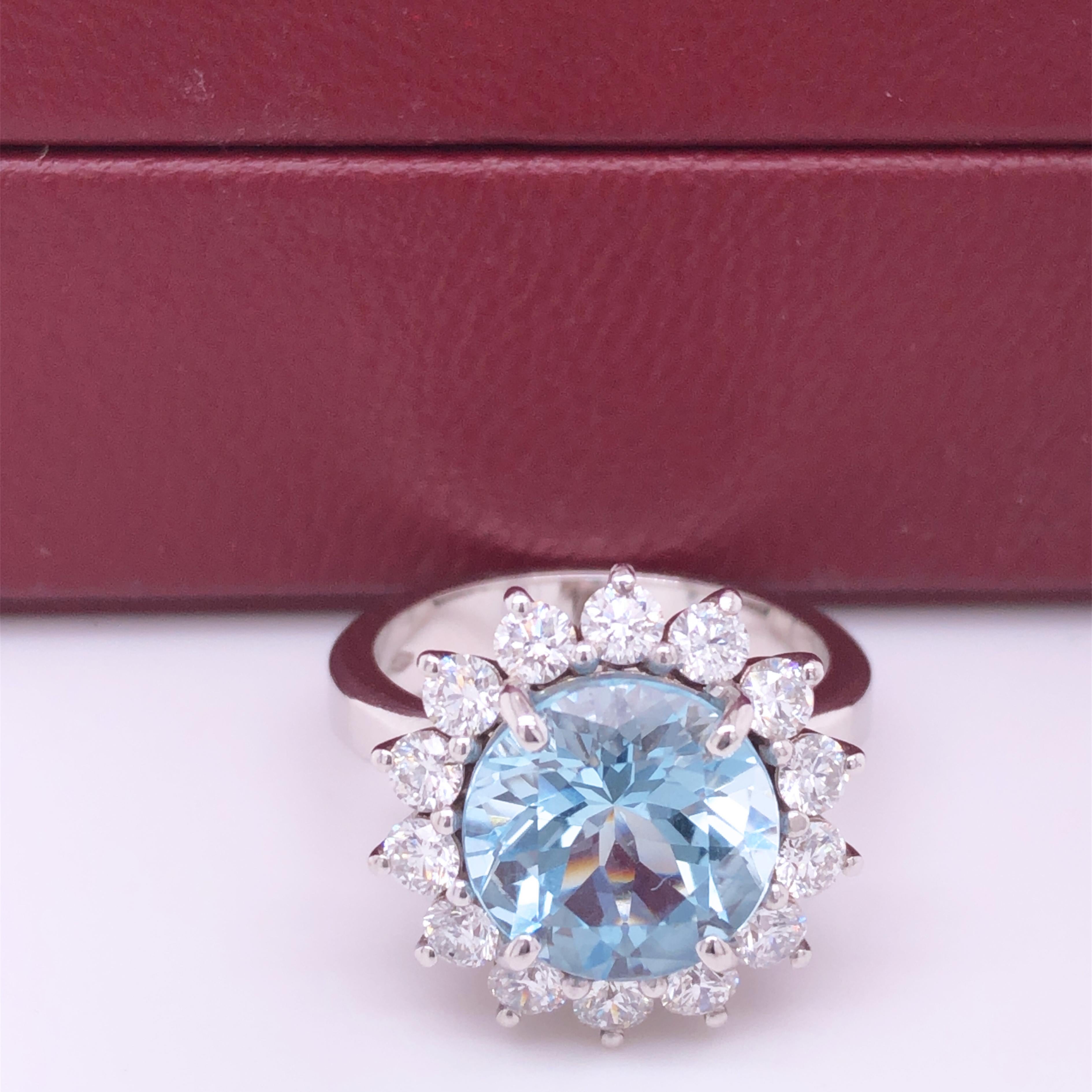 One-of-a-kind 3.25 Carat Brilliant Cut Natural Brazilian Aquamarine(diameter 0.393in, 10mm) in a Chic yet Timeless One Carat White Diamond(F-G, Vvs1) 18Kt White Gold Halo Setting.
We are proud to offer this awesome piece perfect as Engagement Ring