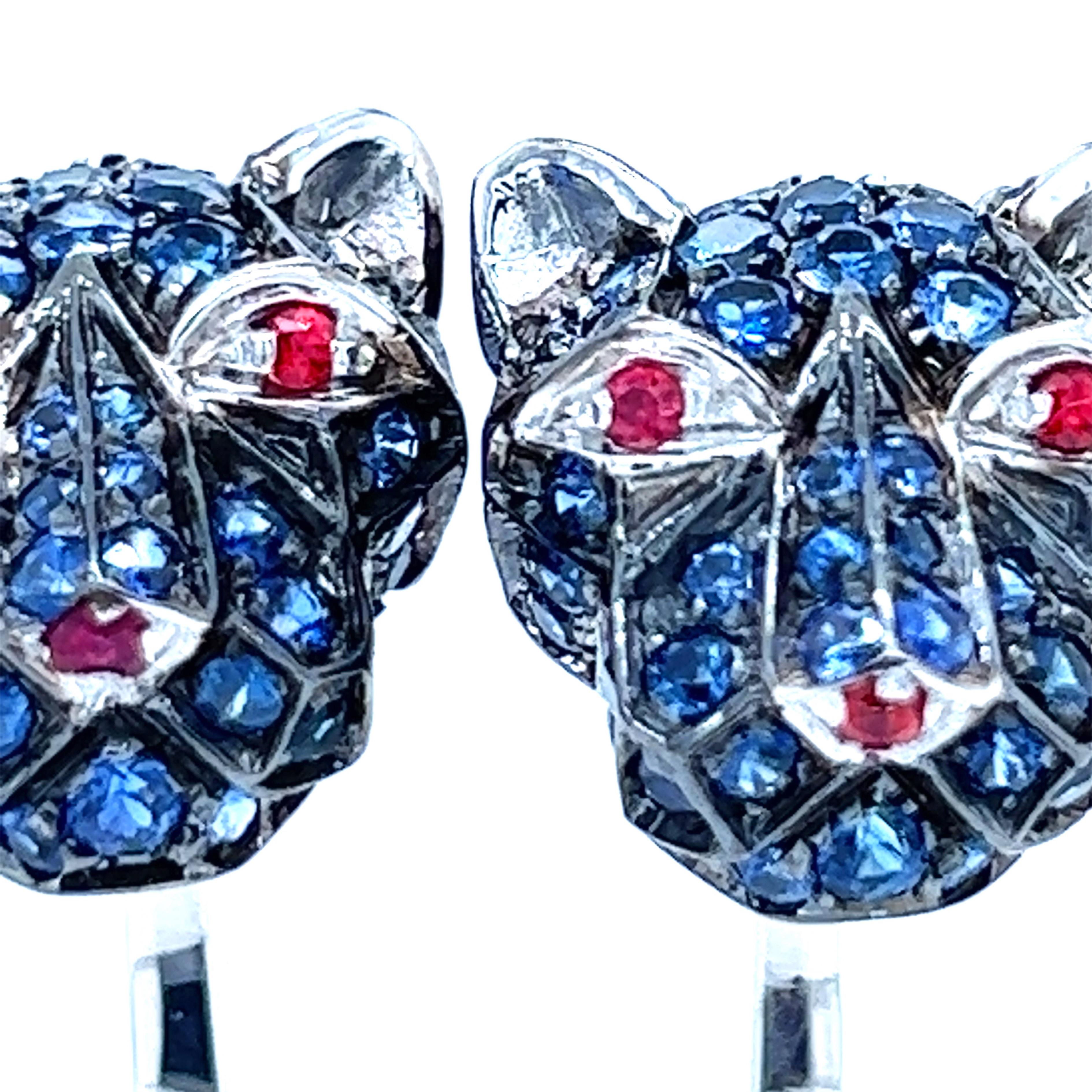 Awesome, Unique yet Timeless, Absolutely Chic 3.97 Carat Natural Royal Blue Sapphire, Eyes and Nose set with 0.32 Carat Natural Round Ruby, Cougar Head Shaped T-Bar Back in a  White Gold Setting Cufflinks.
In our smart fitted whiskey brown suede
