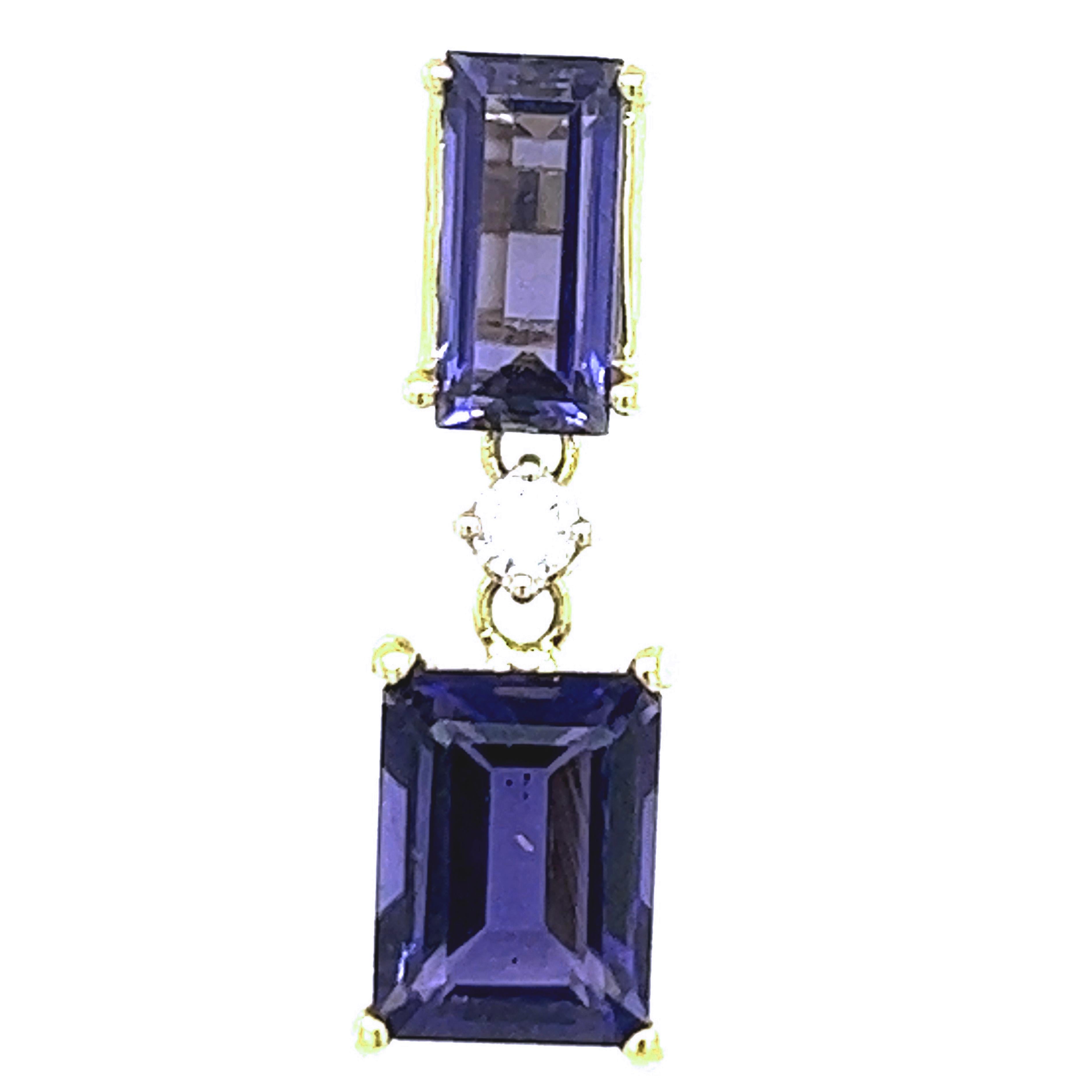 Chic yet timeless  4.26 Carat Emerald Cut Natural Iolite in a 0.10Kt  White Diamond 18KT Carat Yellow Gold Setting.
These top quality stones were carefully hand inlaid in Germany.
In our smart fitted suede leather case and pouch.
Total Lenght 0.905