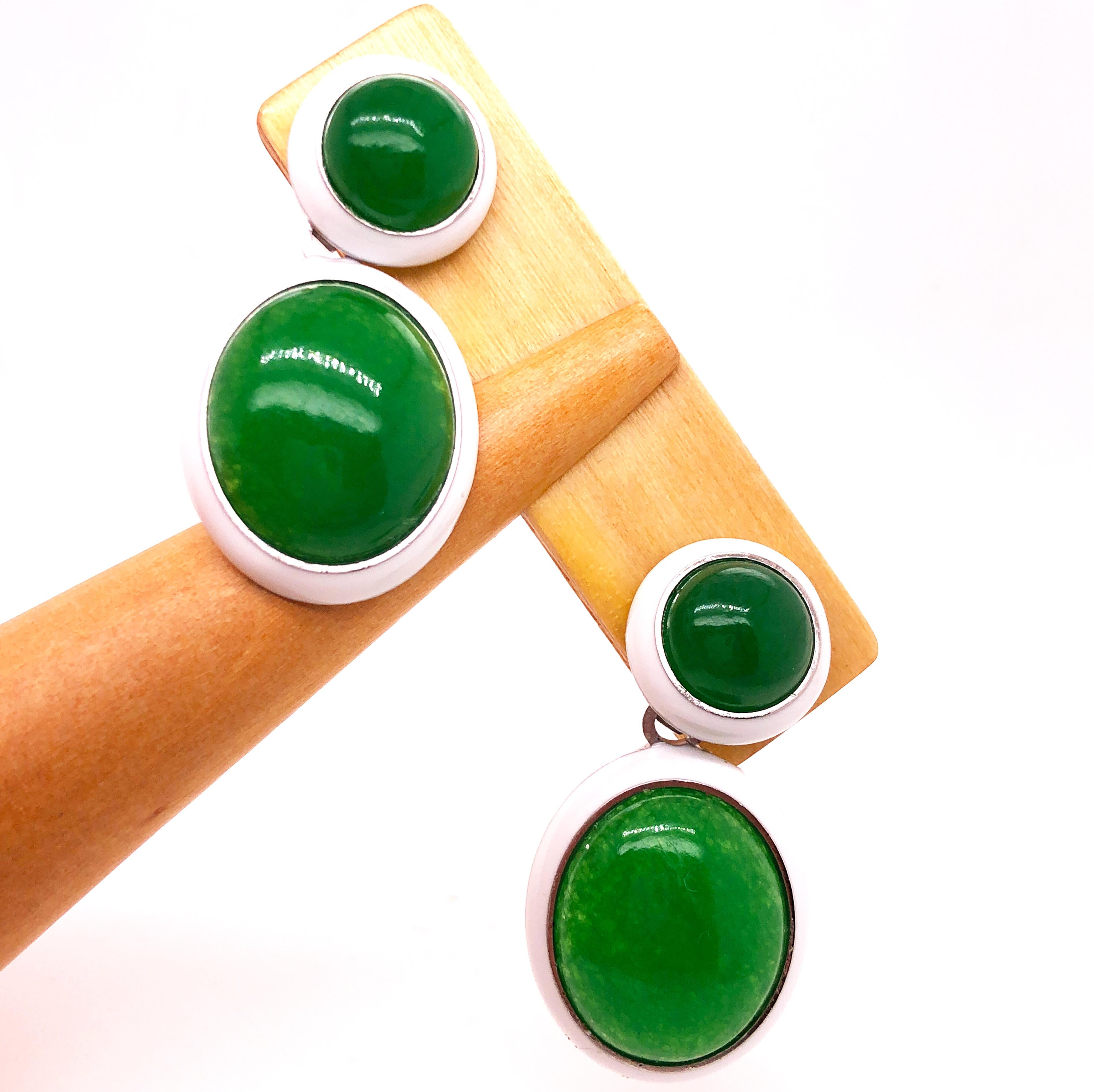 One-of-a-kind Contemporary Chic Earrings Featuring  44.8 Carat Natural Green Jade Cabochons  in a pure White Hand Enameled Sterling Silver Setting.
The color-changing of the Green Jade's cabochon combined with White Hand Enameled Sterling Silver