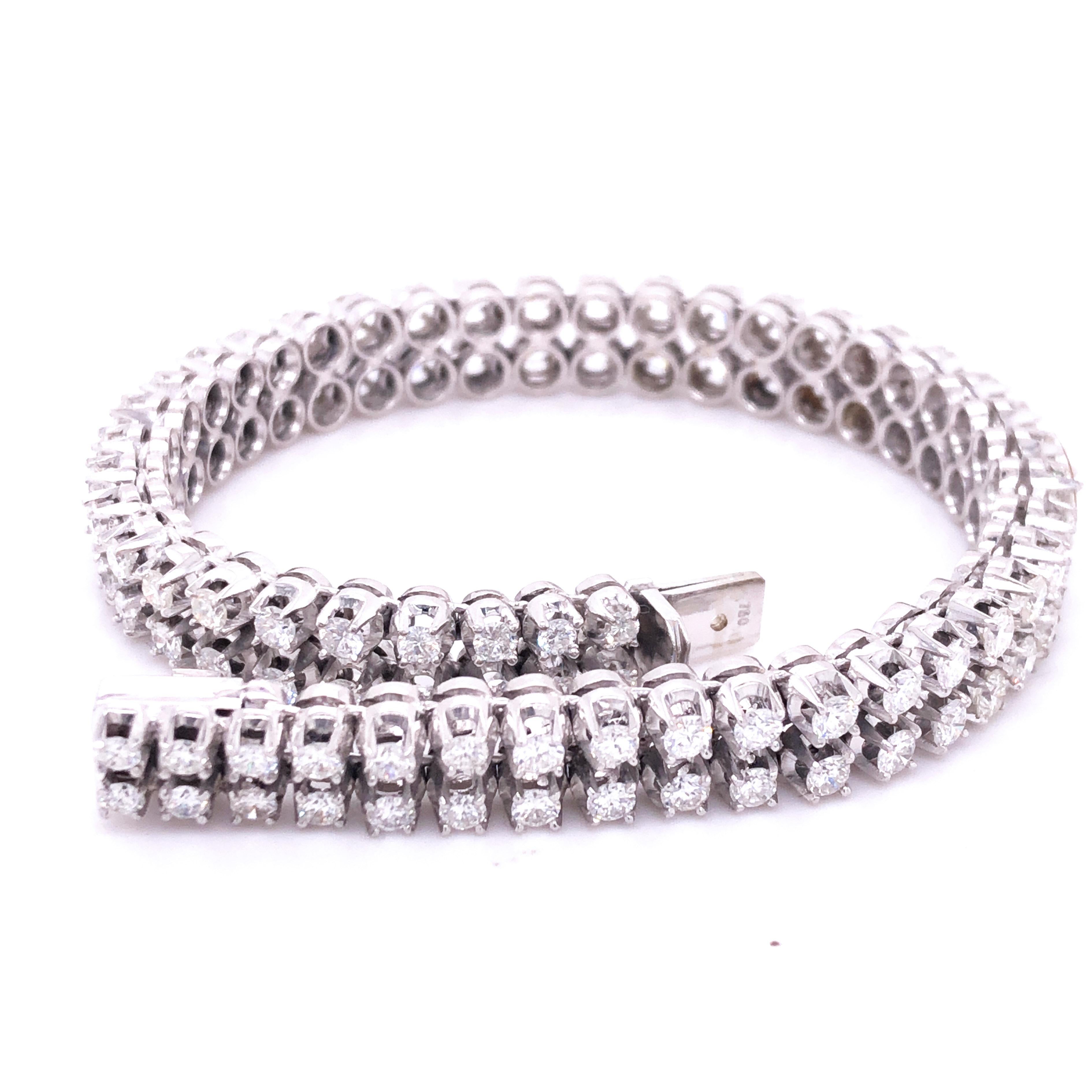 One-of-a-kind, Timeless, Two Lines Tennis Bracelet featuring 98 Brilliant Cut Top Quality White Diamond, total weight 6.41 kt, 0.82 OzT, 24.5grams, 18kt White Gold Handcrafted Setting.
Diamond's Quality is E-F VvS1.
Total Lenght 7.1 inches, 18cm 
In
