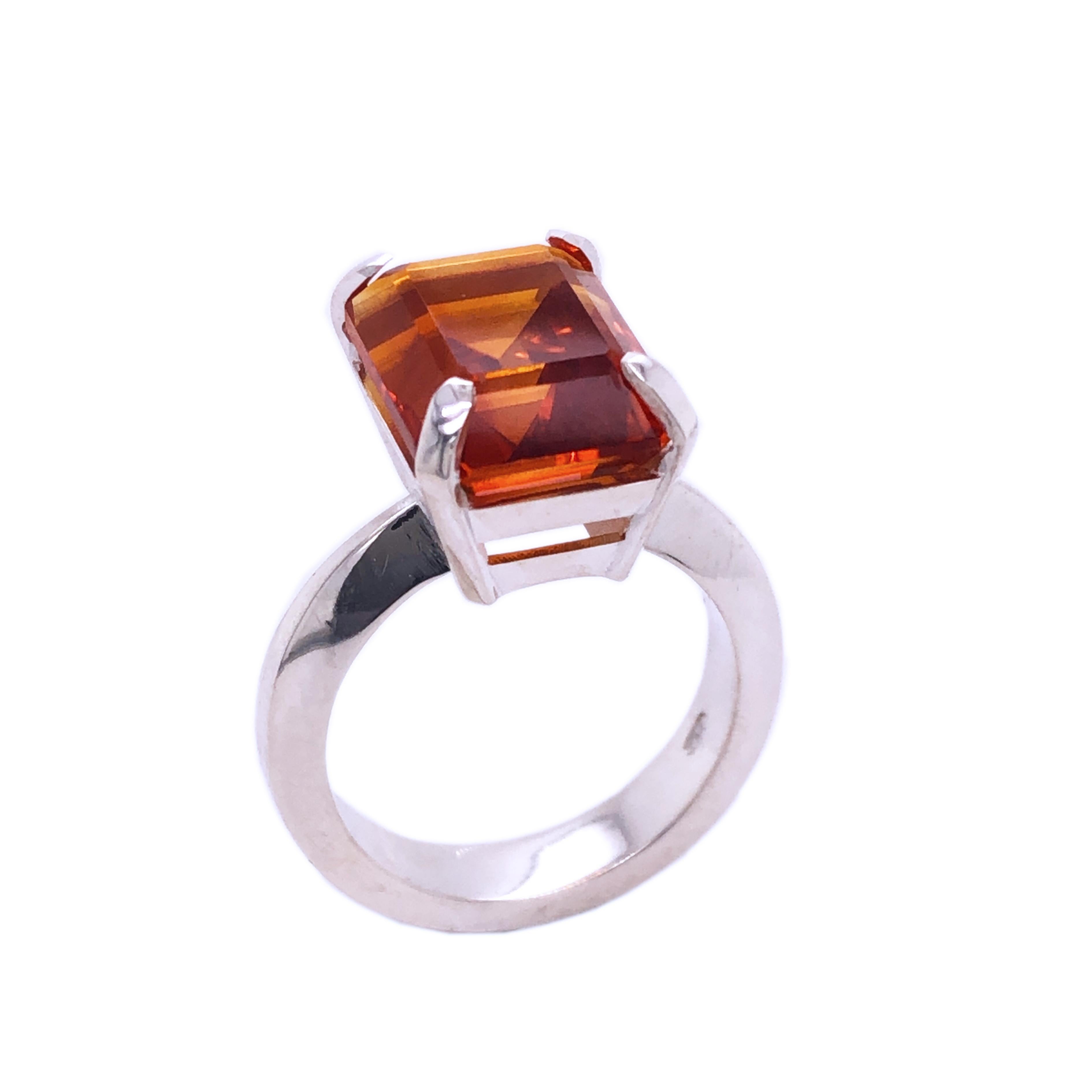 One-of-a-kind 7.60 Carat Emerald Cut Natural Madeira Citrine(0.531inches lenght 0.424inches width, 12.30x10.0mm) in a Chic yet Timeless Mirror Finish Sterling Silver Cocktail Setting.
We are proud to offer this awesome piece perfect as Engagement