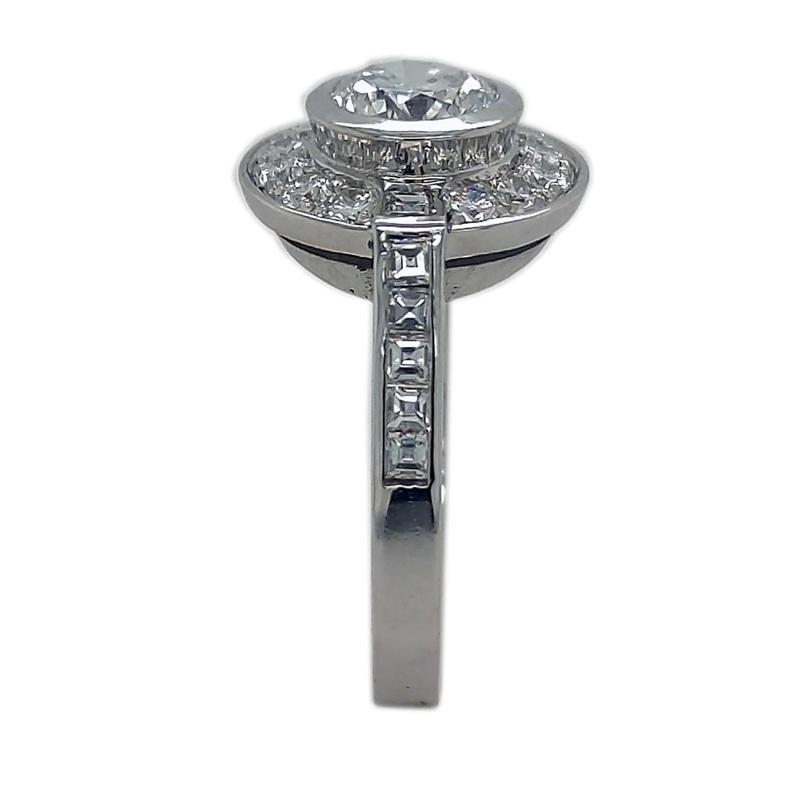 One of a kind wedding ring featuring a HRD Certified 0.93ct E color brilliant cut white diamond, 12 square cut white diamond weighing 0.50ct and 12 brilliant cut white diamond weighing 0.48ct in a sumptuous, architectural timeless 18kt white gold