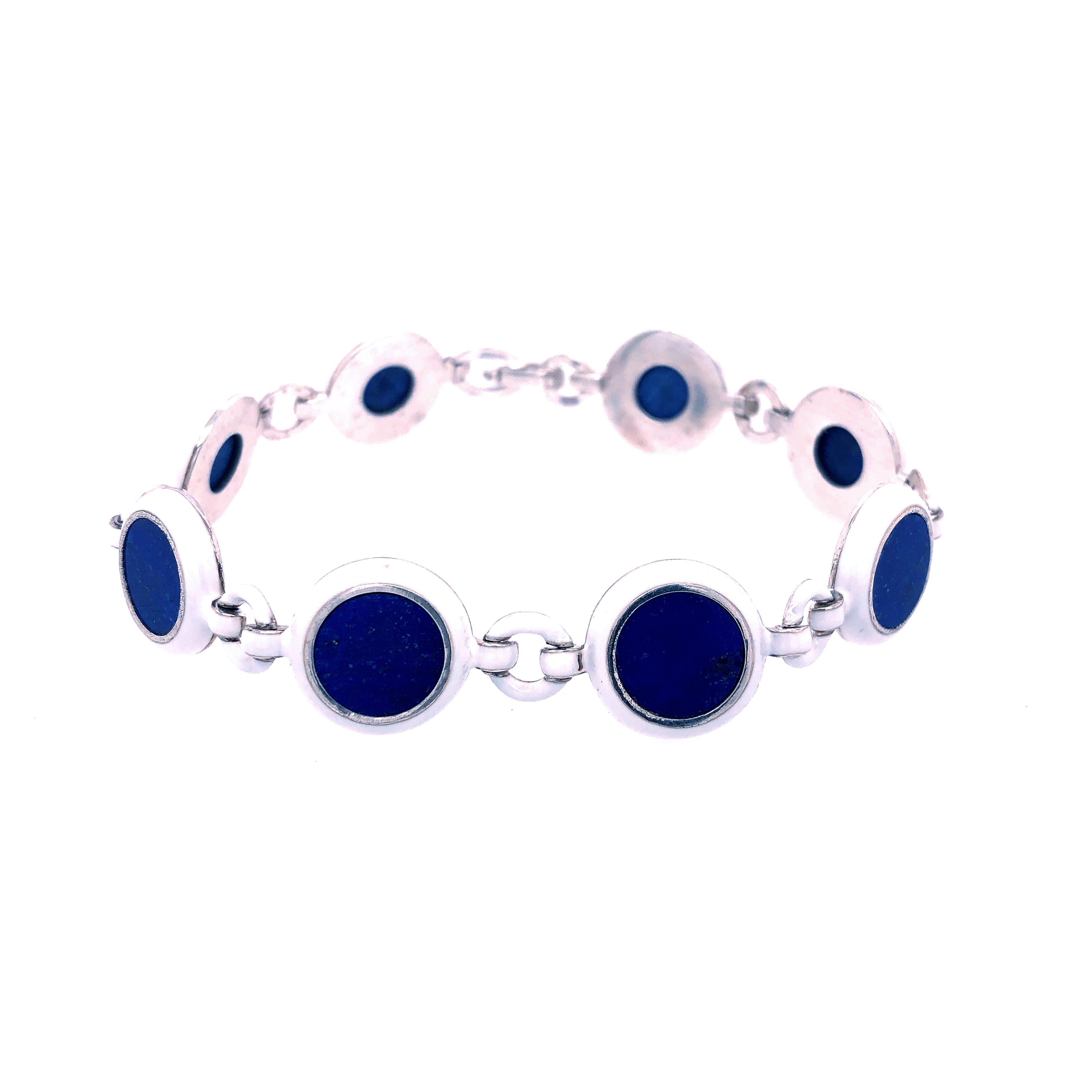 Chic yet Timeless One-of-a-kind Bracelet featuring 43Kt Natural Hand Inlaid Blue Lapis Lazuli Disk in a 0.75OzT White Hand Enameled Handcrafted Sterling Silver Setting.

In our fitted Black Box and Pouch
Bracelet Total Lenght is 7.55 inches, 192mm 