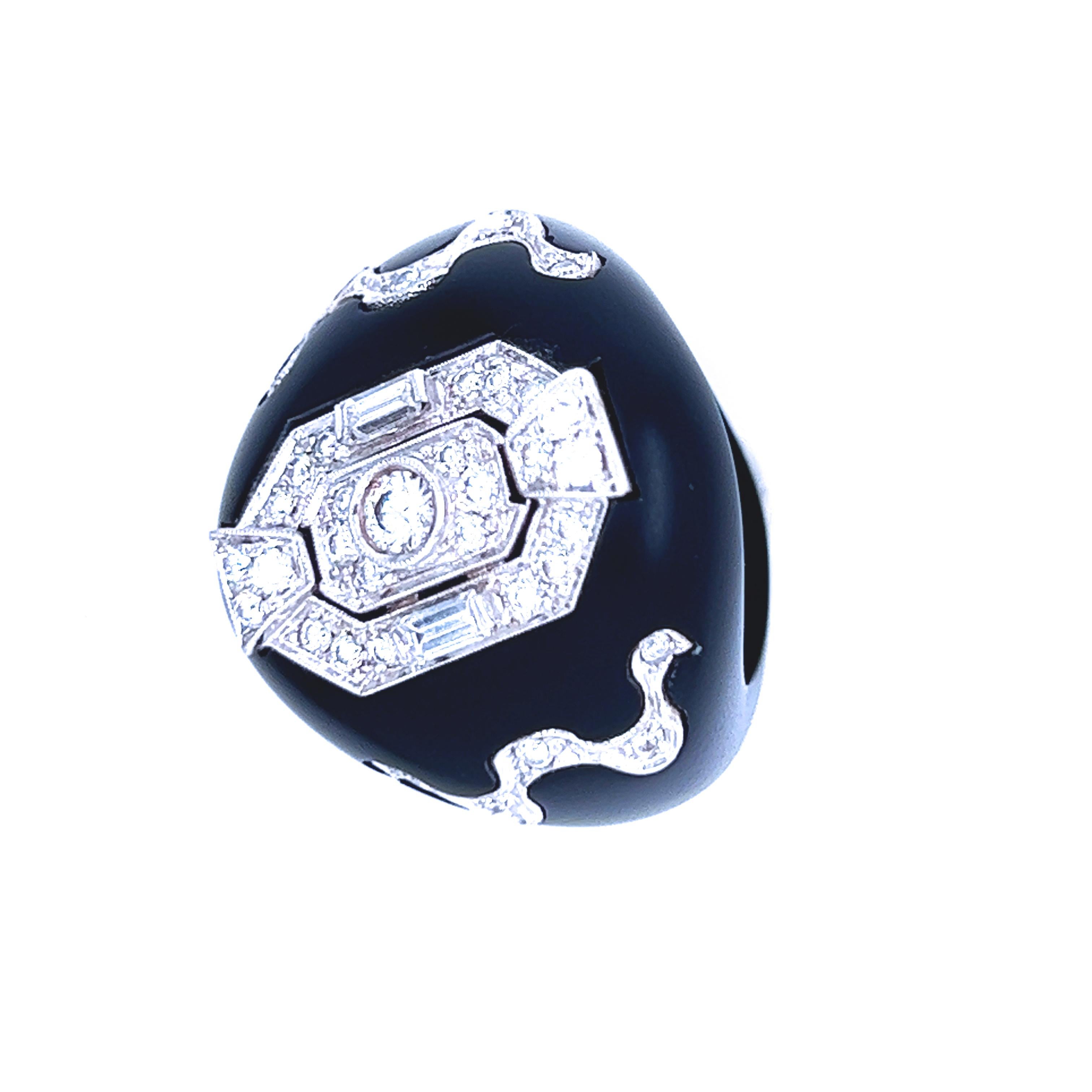 The top of an original 1930, antique Art Déco, one-of-a-kind jewel set in a contemporary hand inlaid jet ring, to create a timeless, absolutely chic piece.
 1.02Kt Top Quality White Baguette and Brilliant Cut Diamond combined with exquisite