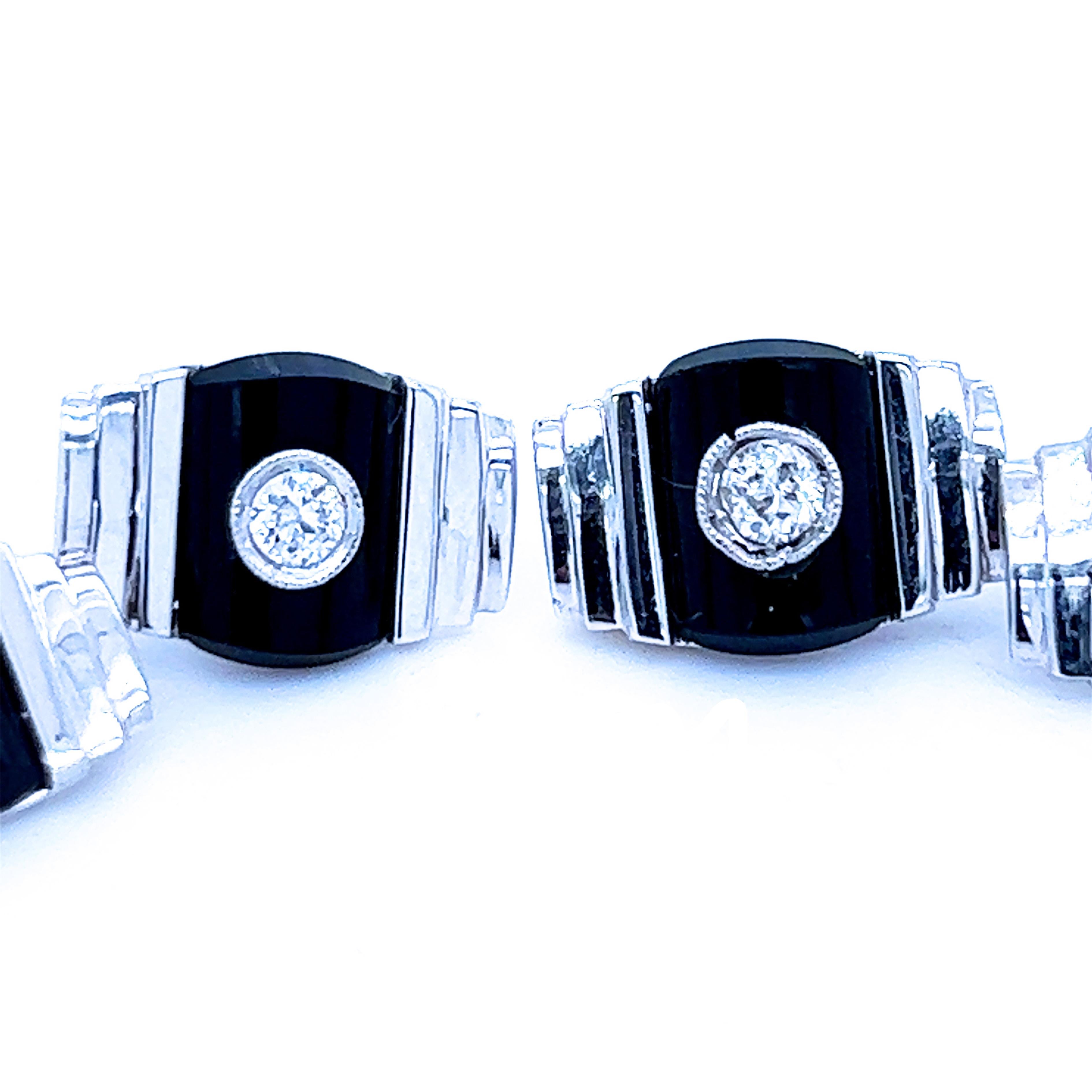 Original 1960 Smart, Chic yet Timeless 0.32 White Diamond Brilliant Cut Hand inlaid Onyx 18k White Gold Setting Cufflinks.
These cufflinks are as new,never used or worn, in our tobacco suede leather case and pouch.
