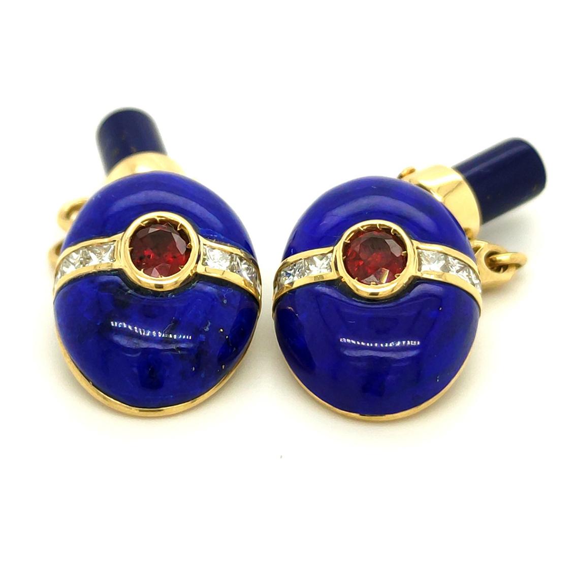 A pair of one-of-a-kind cufflinks, absolutely chic and timeless, featuring two hand-inlaid oval lapis cabochons embracing two oval Burmese natural rubies weighing 0.93 ct and twelve square-cut white diamonds for a total weight of 0.68 ct set in 18K