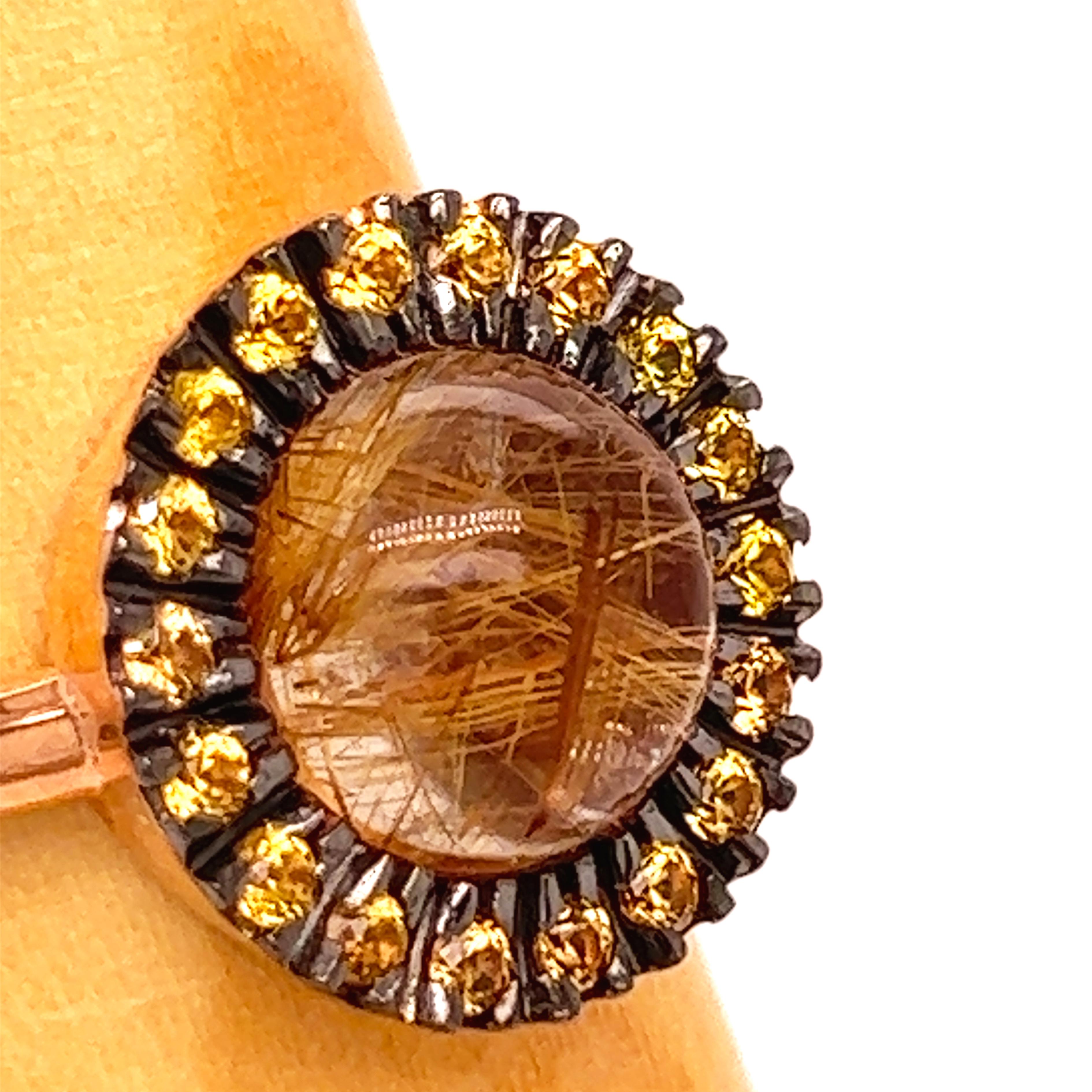 Chic, Unique yet Timeless Contemporary Cocktail Ring featuring a Natural 4.20Kt Rutilated Quartz Round Cabochon surrounded by 0.93Kt Natural Vivid Yellow Sapphire Diamond Cut in an elegant Rose and Black Oxidized Gold Setting: a Stunning, Magical