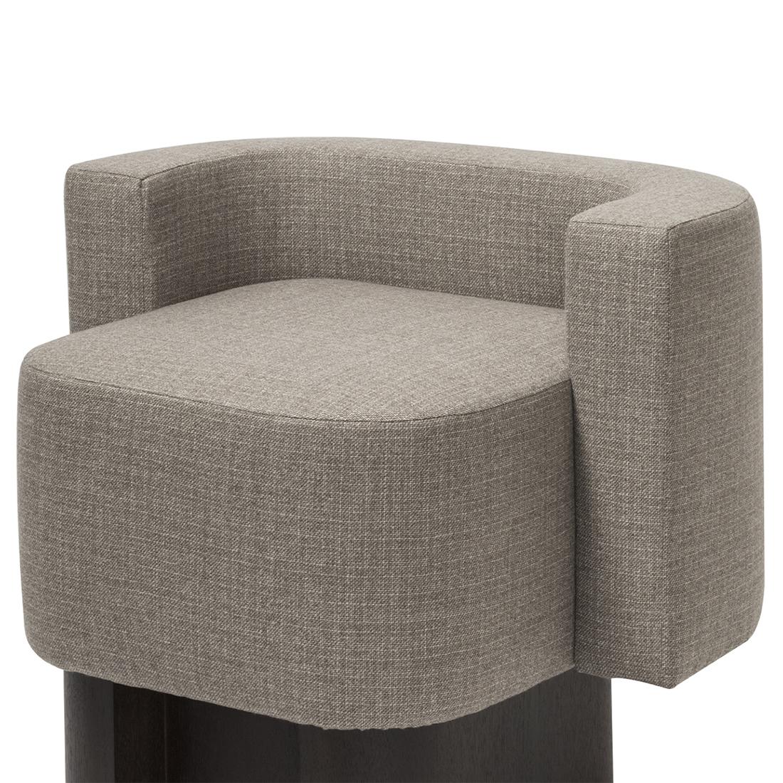 Armchair Bergam with solid walnut base
in blackened finish. Upholstered and covered
seat with cashmere and wool fabric.