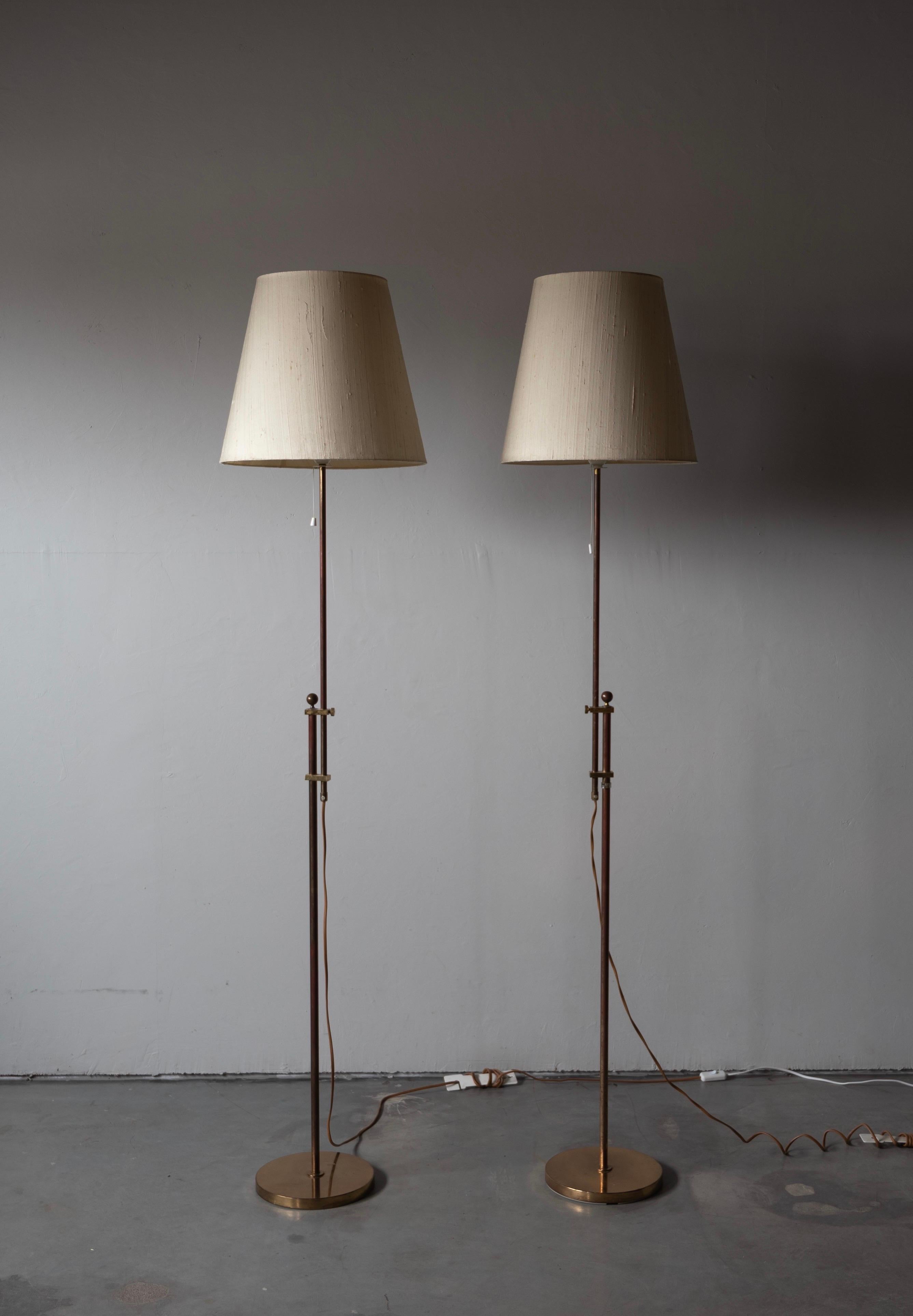 A pair of adjustable floor lamps. Designed and produced by Bergboms, Sweden, c. 1960s. Original fabric lampshades in fair condition.

Other designers of the period include Paavo Tynell, Hans Bergström, Josef Frank, and Kaare Klint.