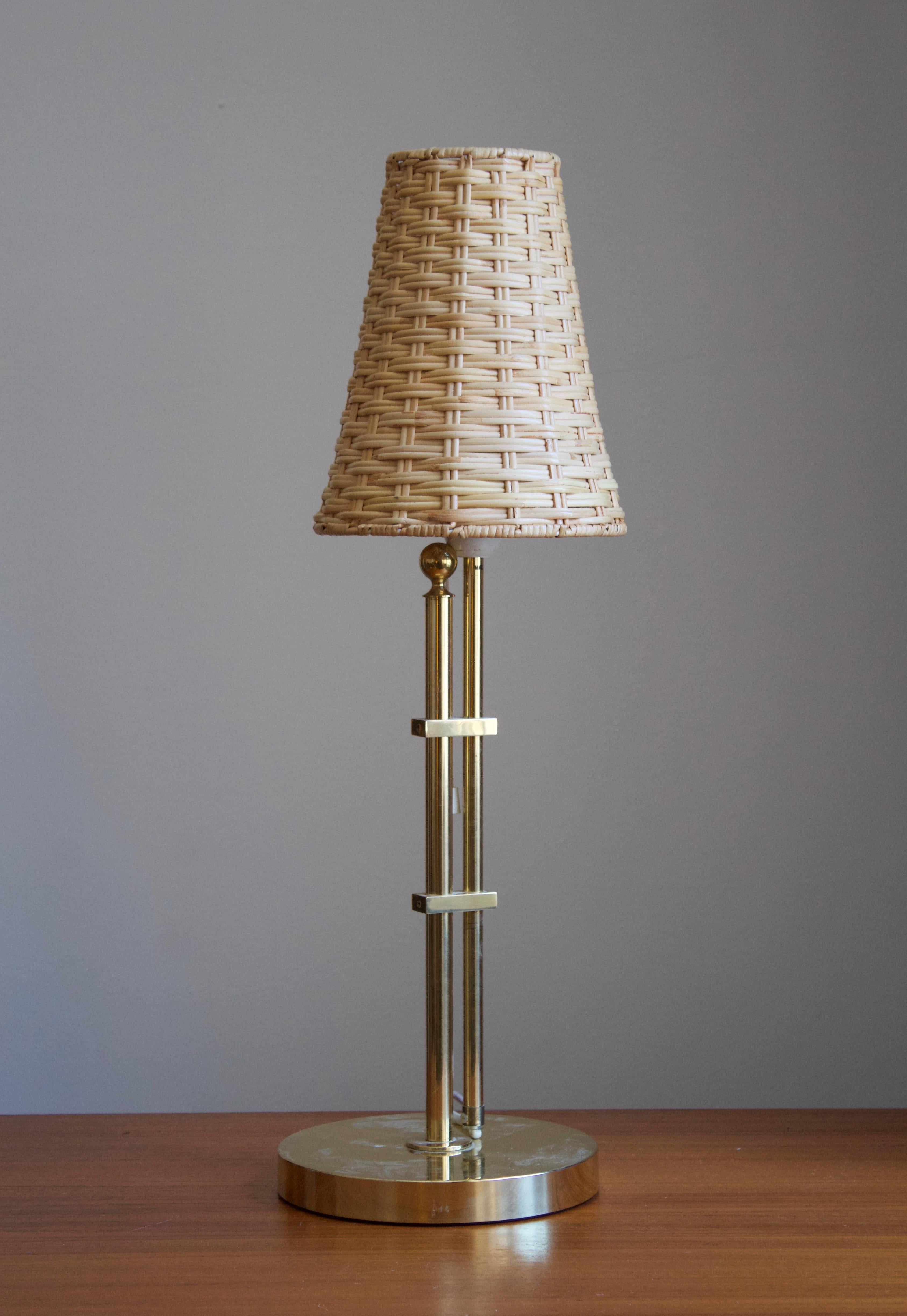 An adjustable table lamp. Designed and produced by Bergboms, Sweden, Designed c. 1960s. This example c. 1970s-1980s production. Assorted vintage rattan lampshade.

Other designers of the period include Paavo Tynell, Hans Bergström, Josef Frank,