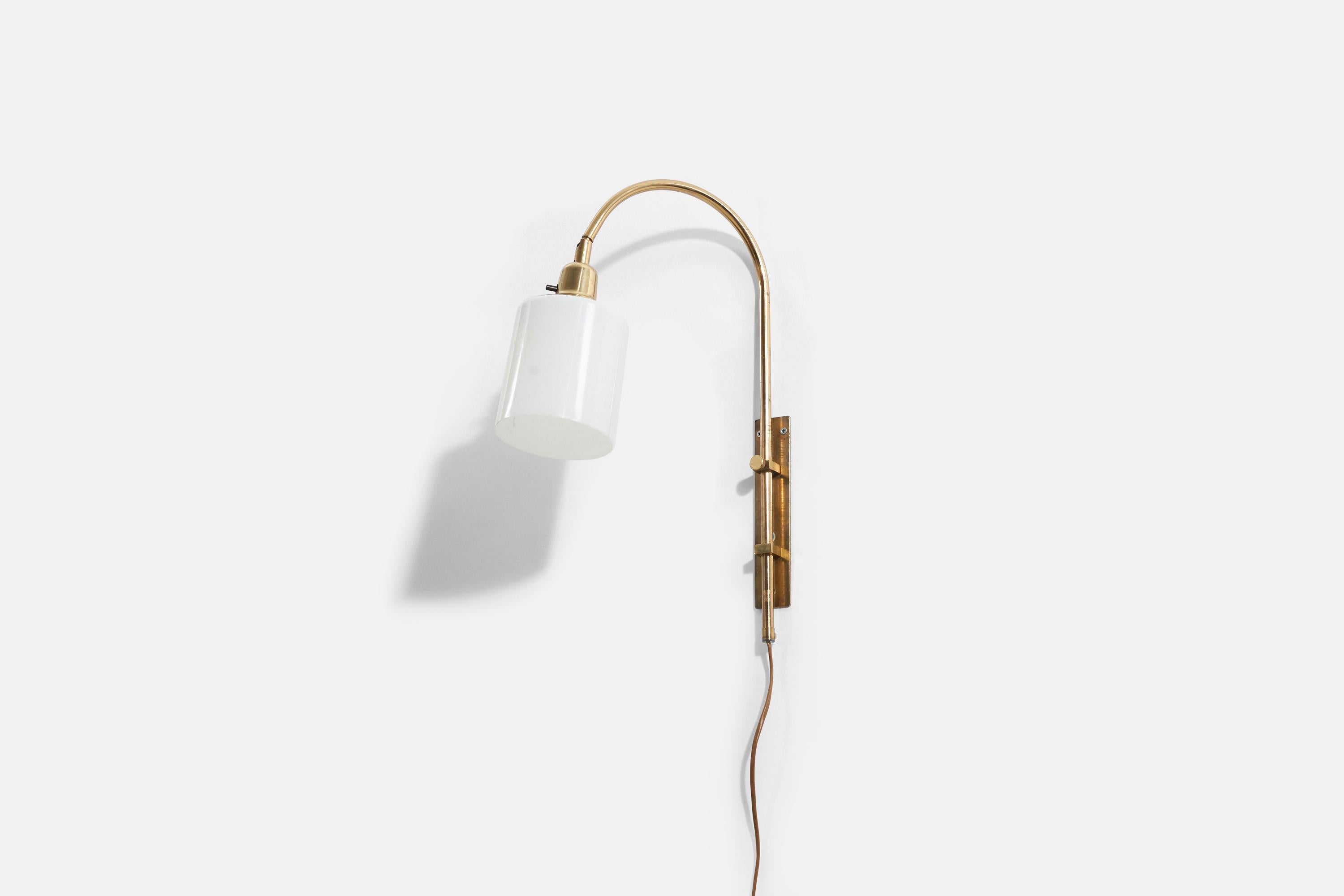 A brass and acrylic adjustable wall light / sconce by Bergboms, Sweden, 1970s.