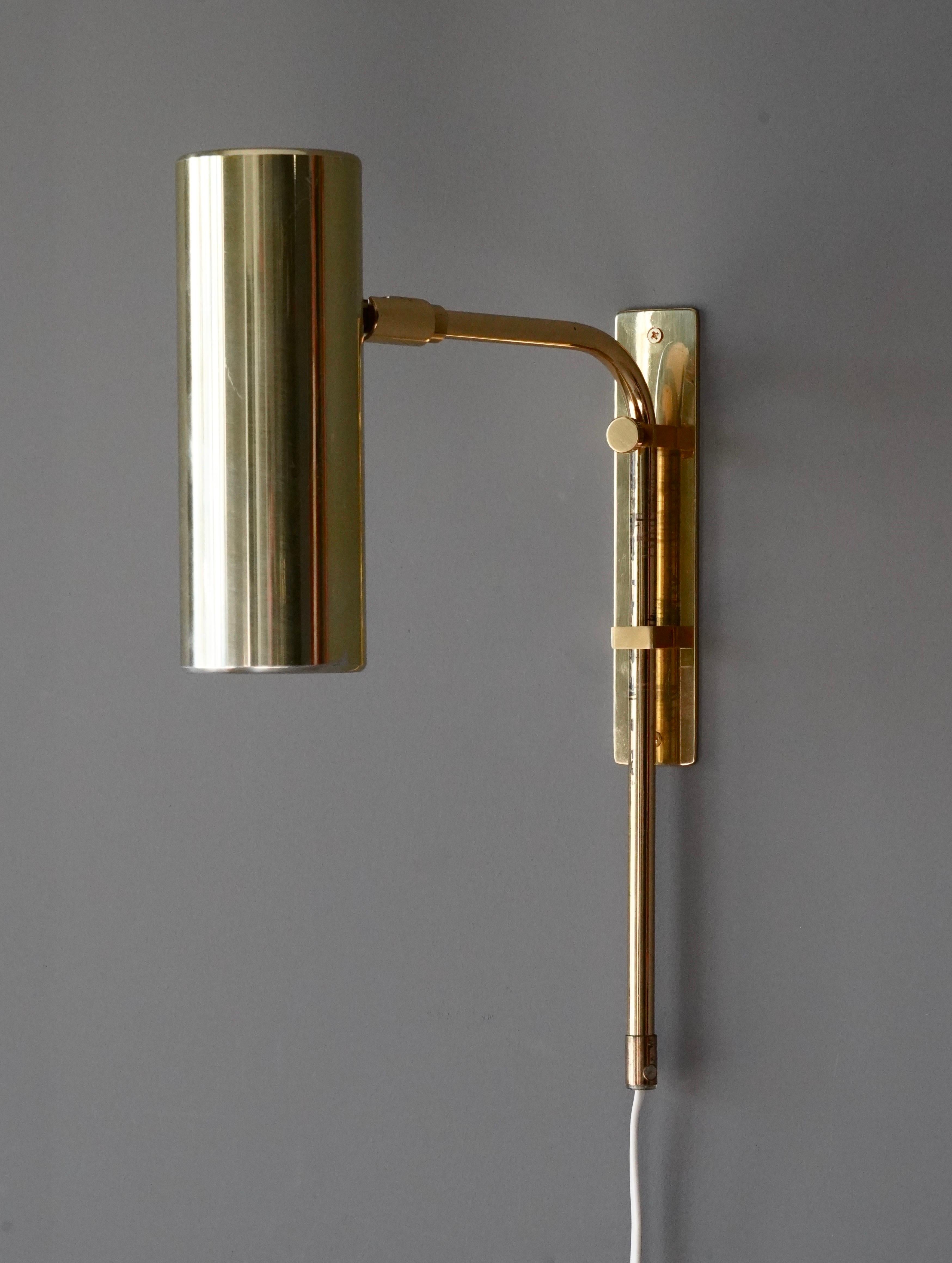Aan adjustable wall lights / wall sconces. Designed and produced by Bergboms, Sweden, c. 1970s. Labeled.

