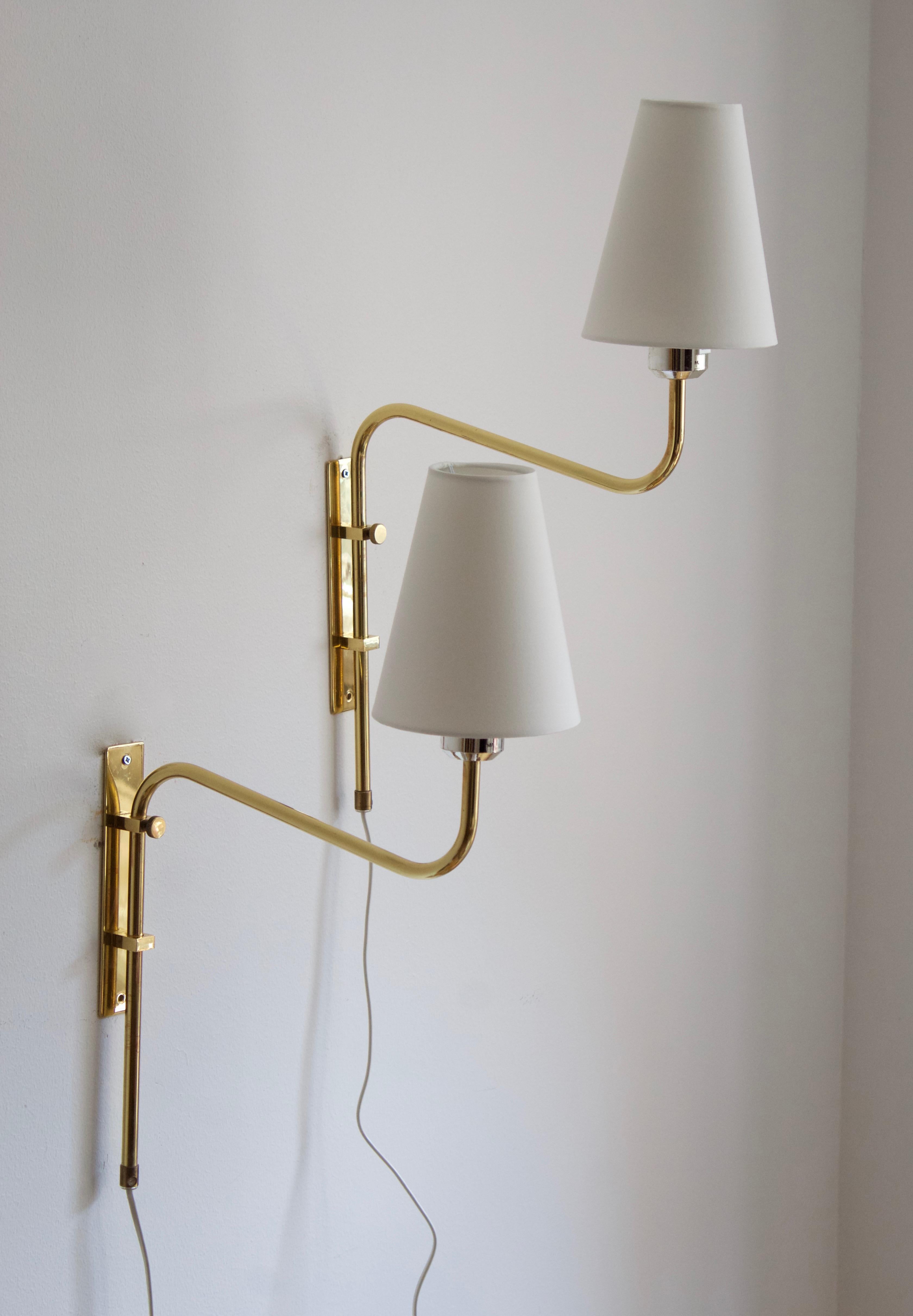A pair of adjustable wall lights / wall sconces. Designed and produced by Bergboms, Sweden, c. 1970s. Labeled.

Measurements include brand new lampshades illustrated.

Other designers of the period include Paavo Tynell, Hans Bergström, Josef