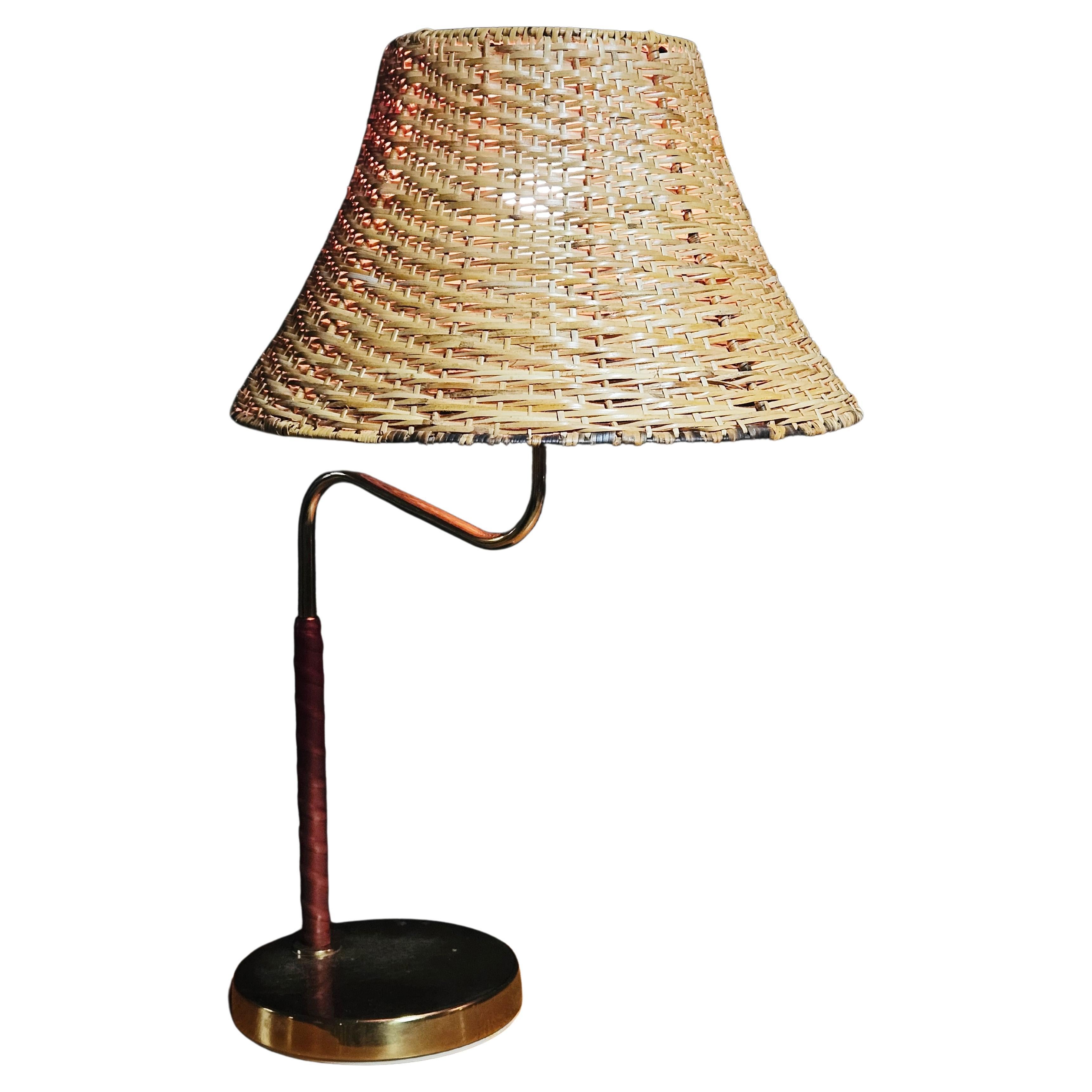 Bergboms, brass and leather table lamp, Sweden, 1960s For Sale
