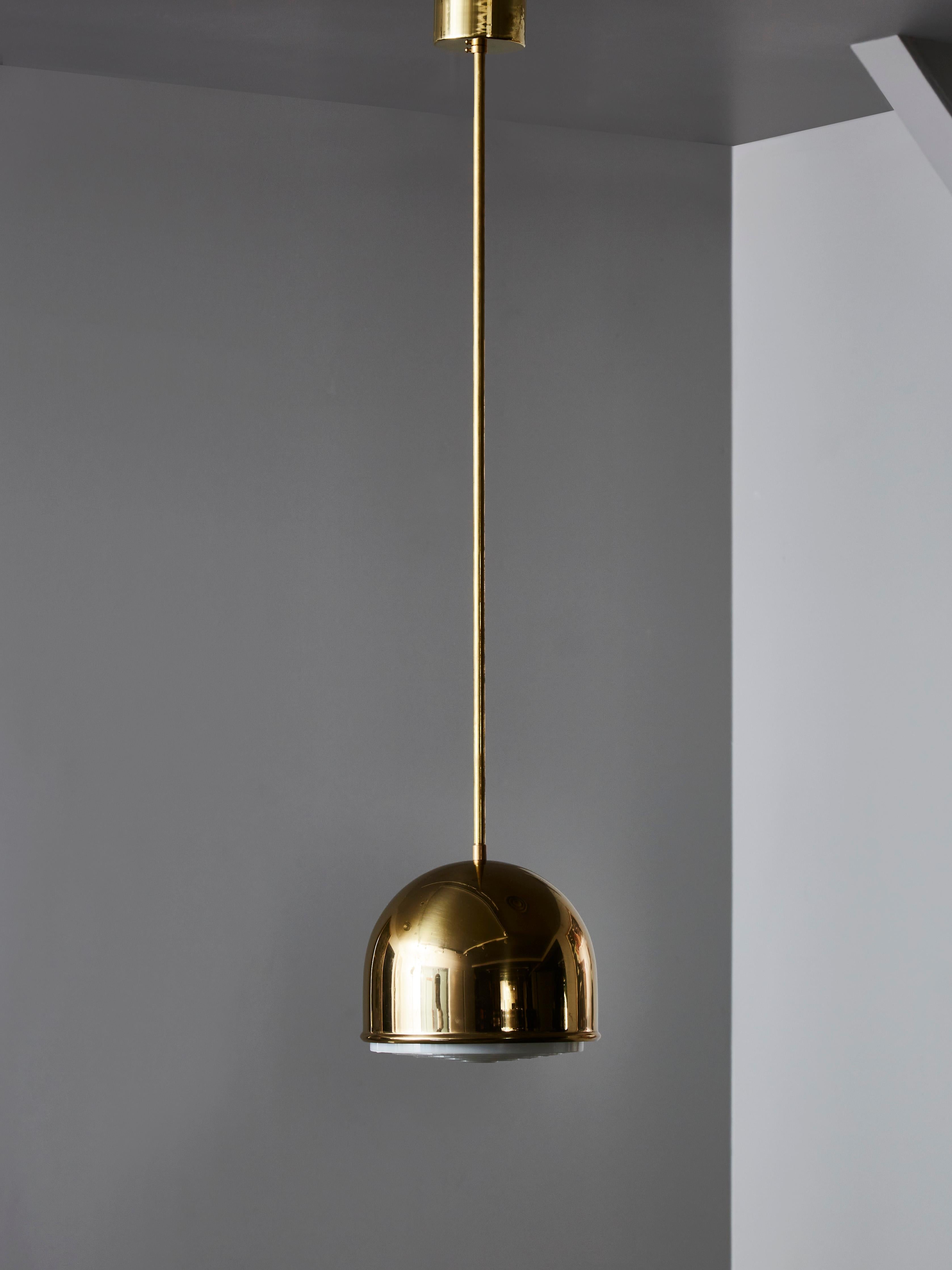 Mid century suspensions by Bergboms in brass with acrylic diffuser.