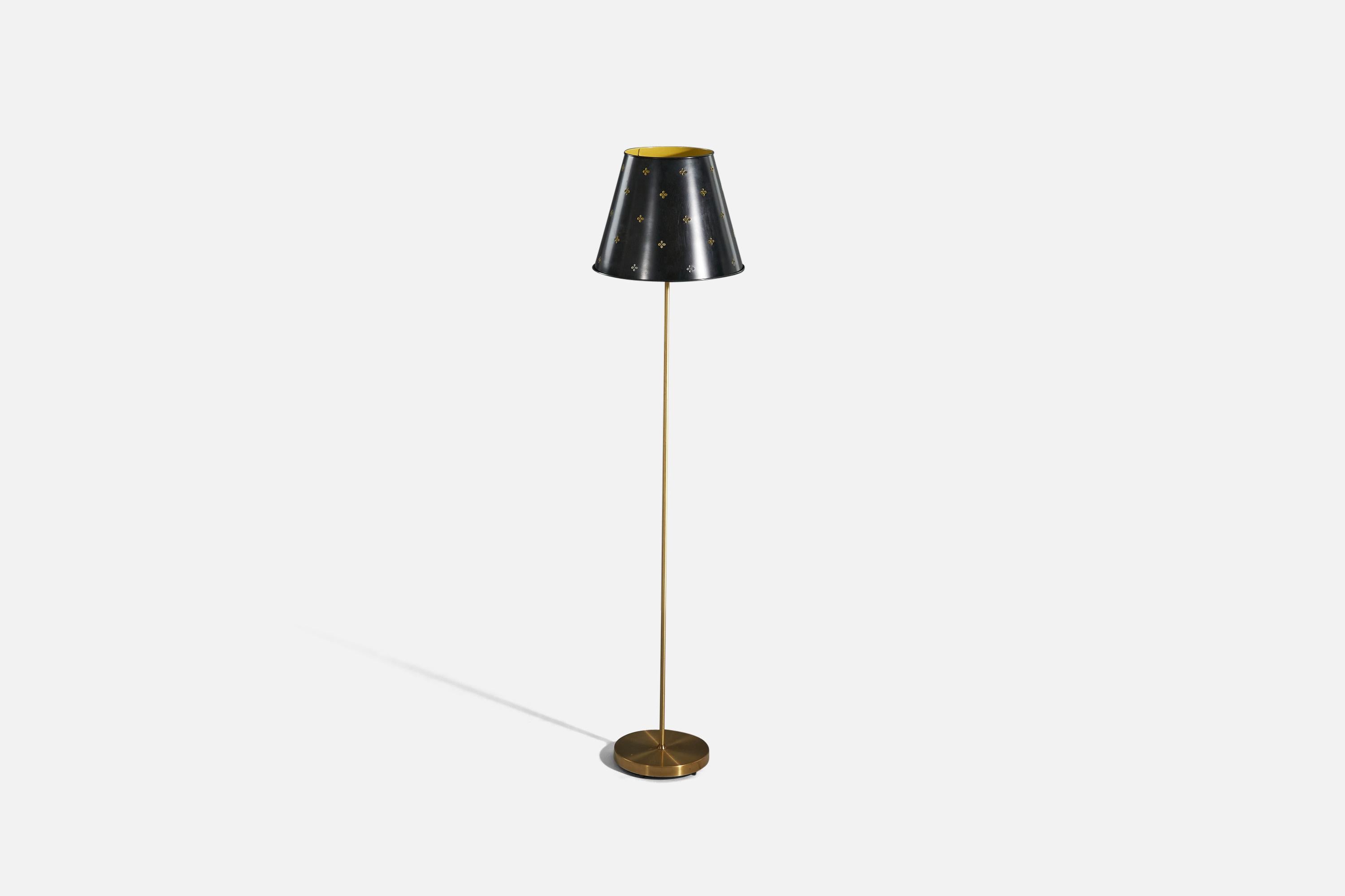 A brass and metal floor lamp designed and produced by Bergboms, Sweden, c. 1960s.

Sold with Lampshade. 
Dimensions stated refer to the floor lamp with the shade. 

