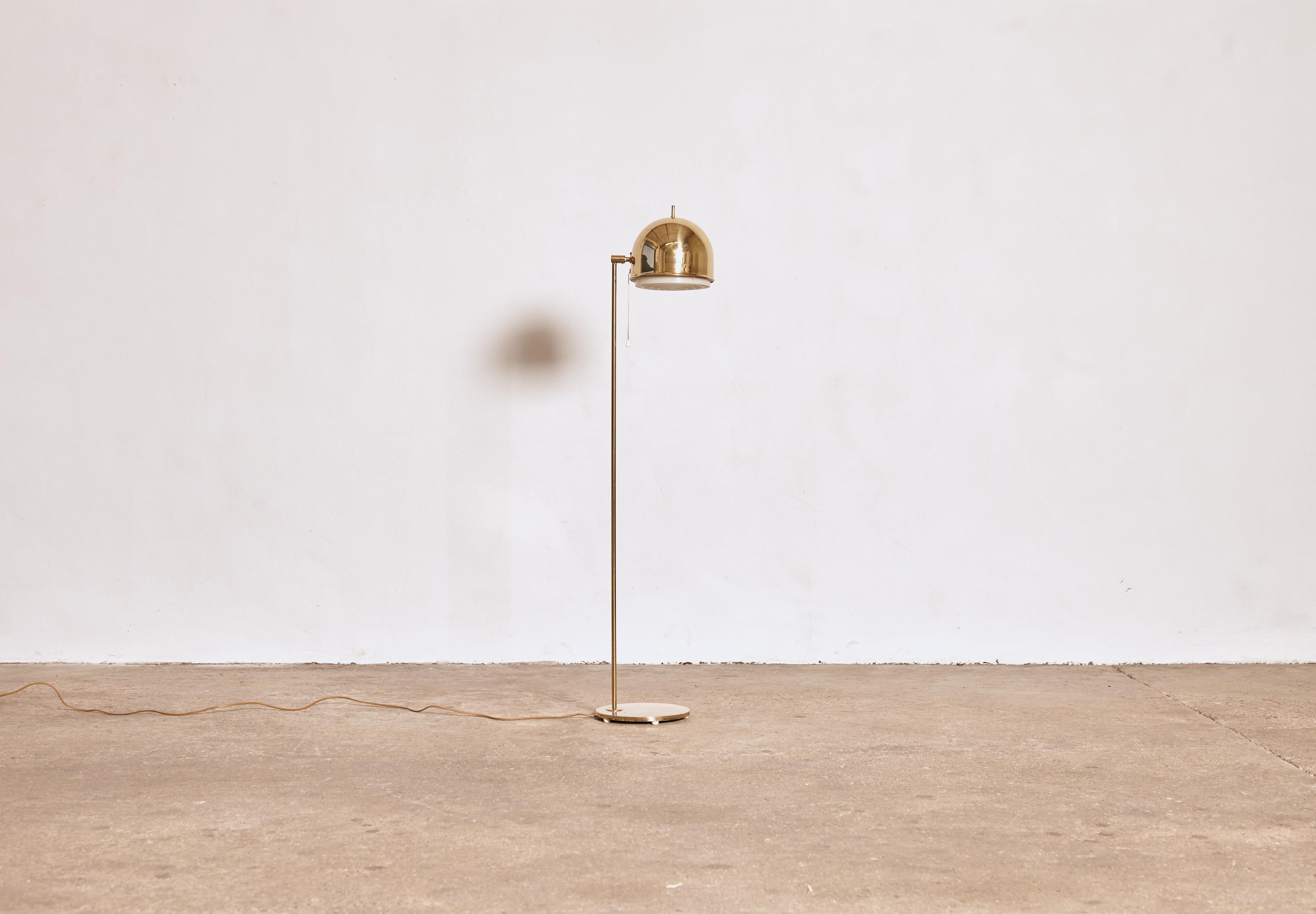 A brass floor lamp, model G-075 manufactured by Bergboms, Sweden, 1960s. In good original working condition with a European plug.     Fast shipping worldwide - please contact us with your location for a quote.
 