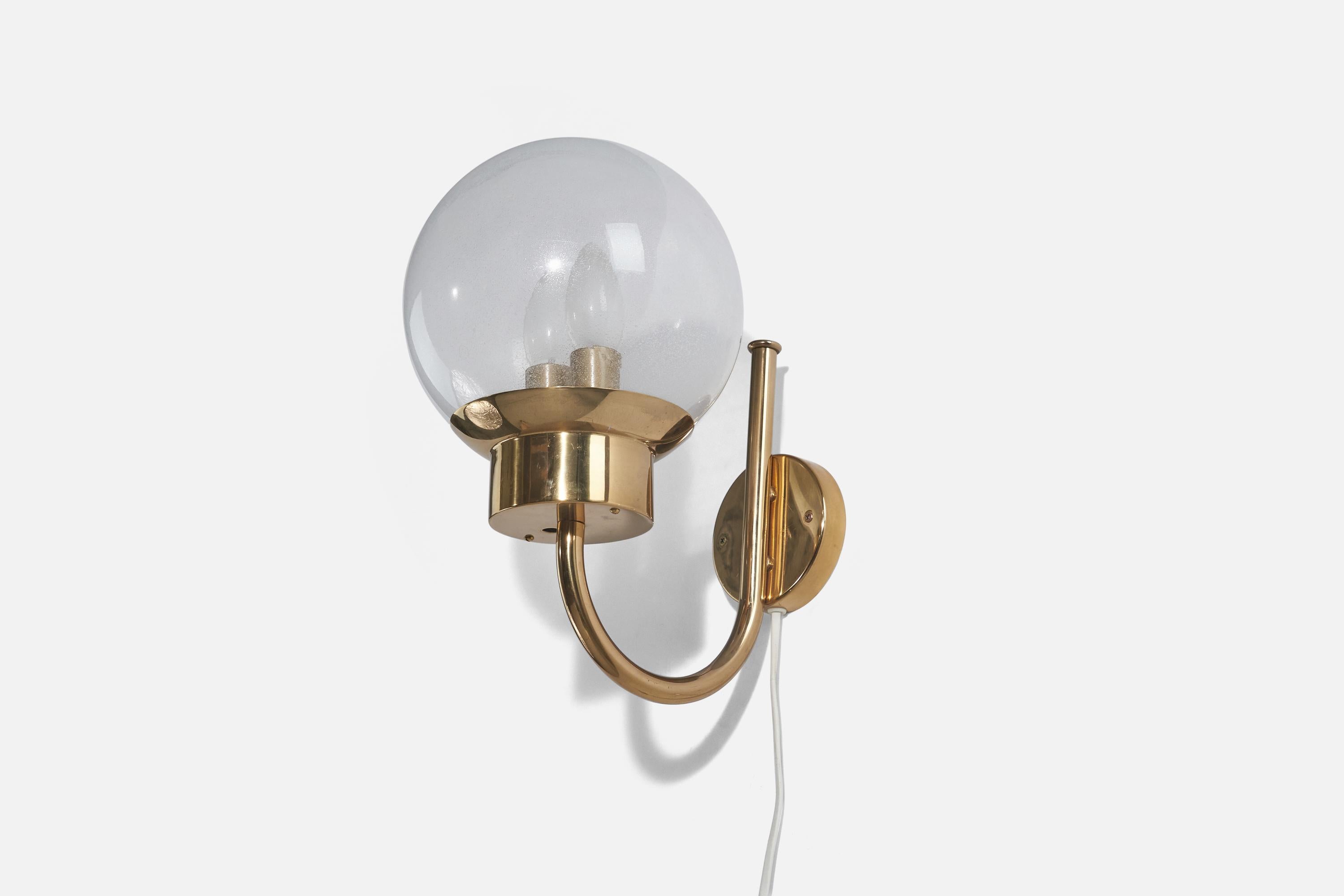 A brass and glass sconce designed and produced by Bergboms, Sweden, 1970s. 

Dimensions of back plate (inches) : 3.83 x 3.83 x 0.77 (height x width x depth).

Socket takes E-14 bulb.
The maximum wattage stated on the fixture is 2 x 25W.