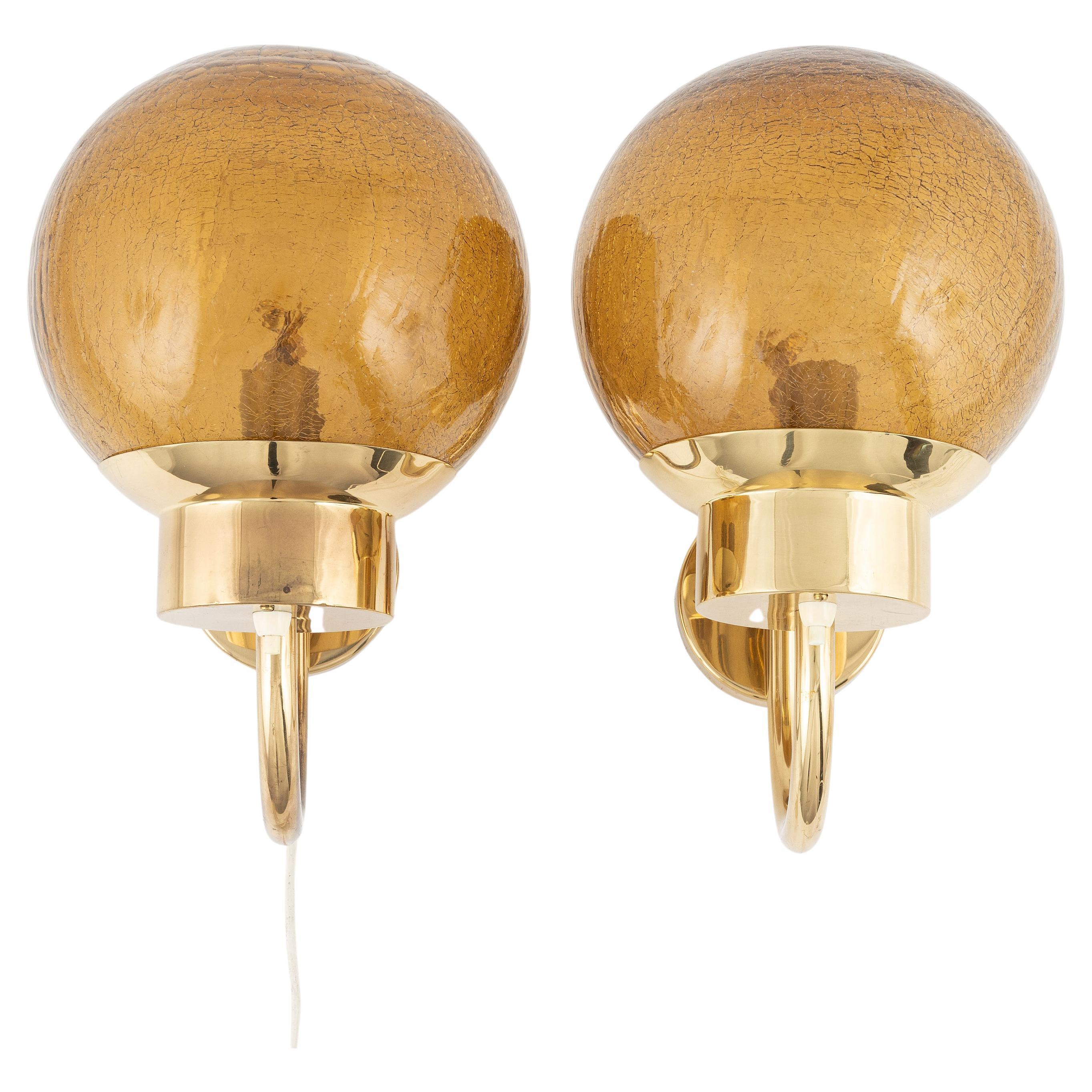 Bergboms sconces a pair in brass and amber glass Sweden 1960