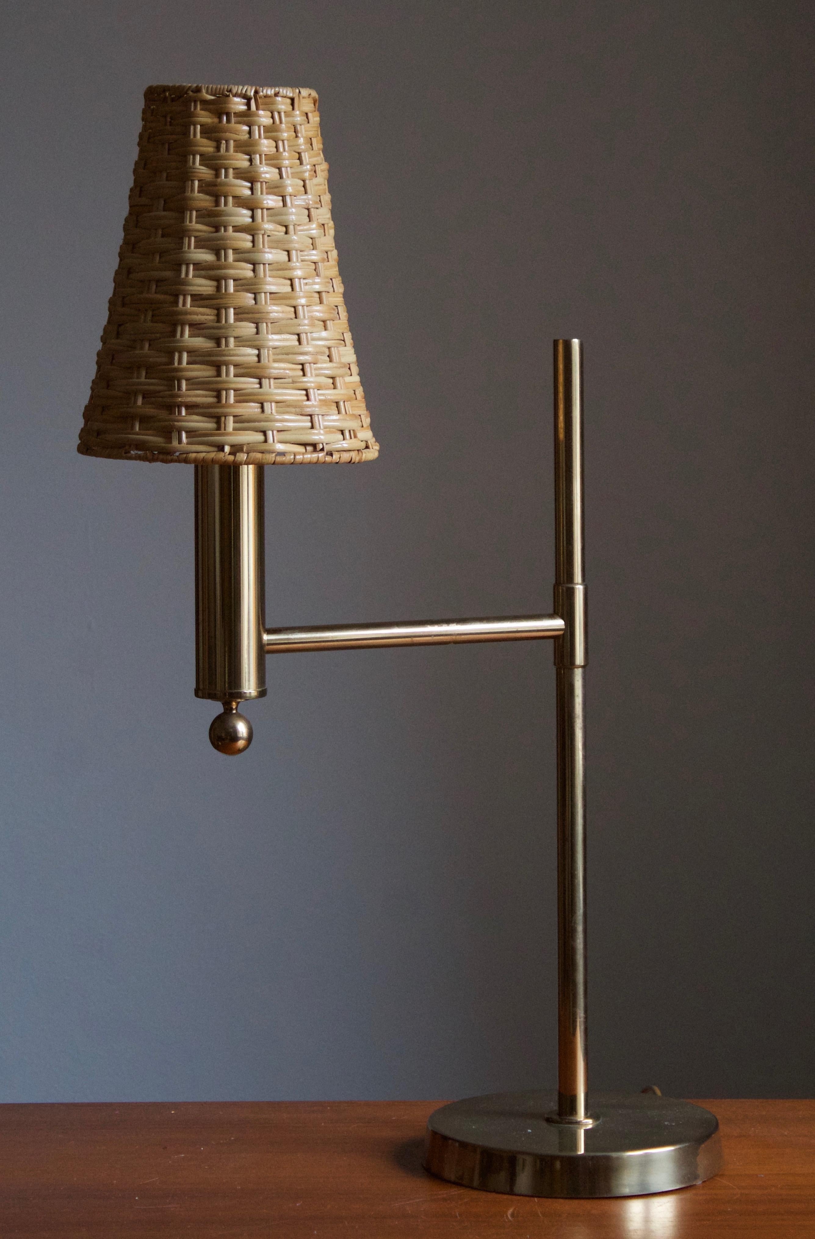 A sizable table lamp. Designed and produced by Bergboms, Sweden, c. 1970s. With an assorted rattan lampshade.

Other designers of the period include Paavo Tynell, Hans Bergström, Josef Frank, and Kaare Klint.