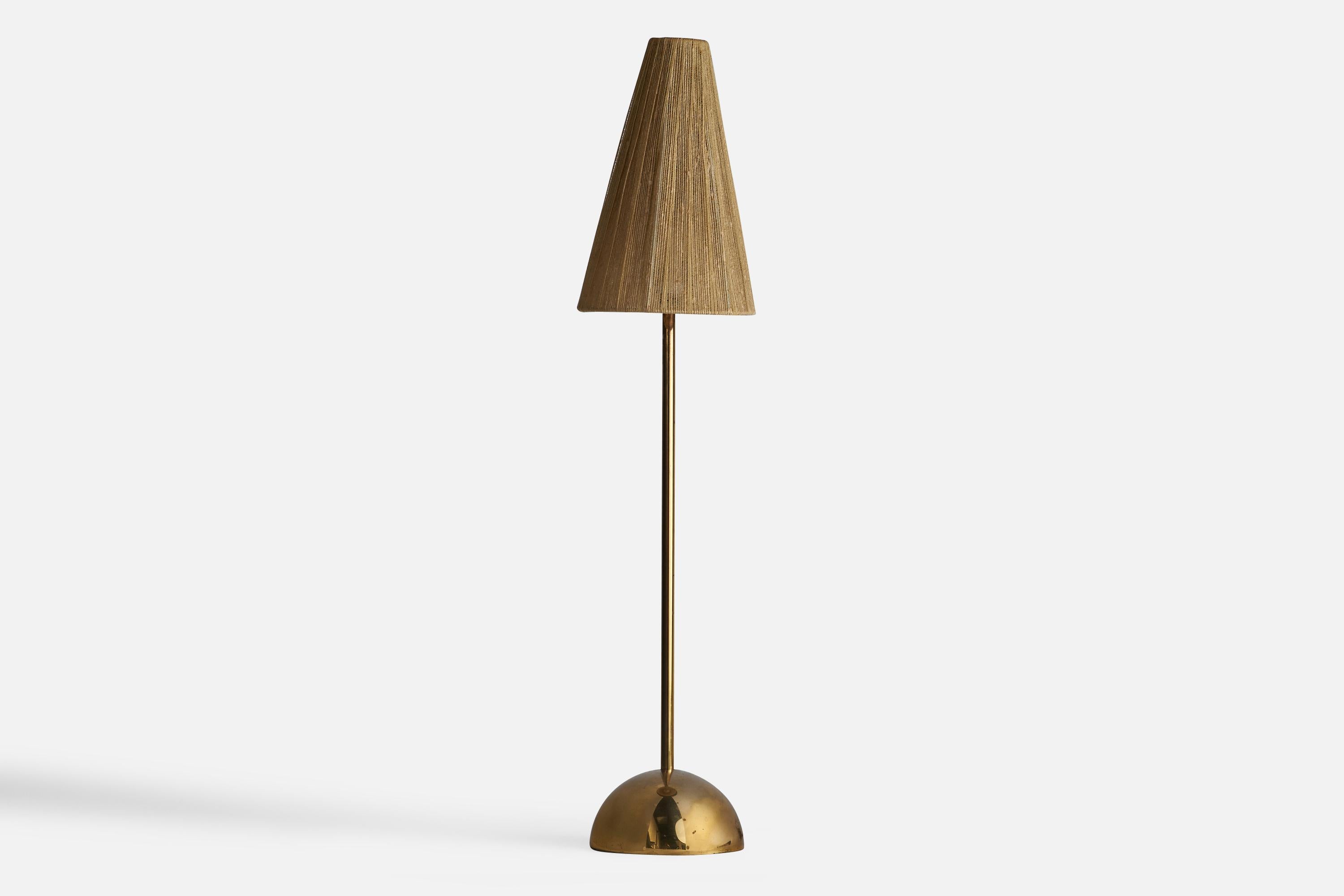 A brass and beige fabric string table lamp designed and produced by Bergboms, Sweden, 1960s.

Overall Dimensions (inches): 28.25” H x 6” diameter 
Bulb Specifications: E-26 Bulb
Number of Sockets: 1
All lighting will be converted for US usage. We is