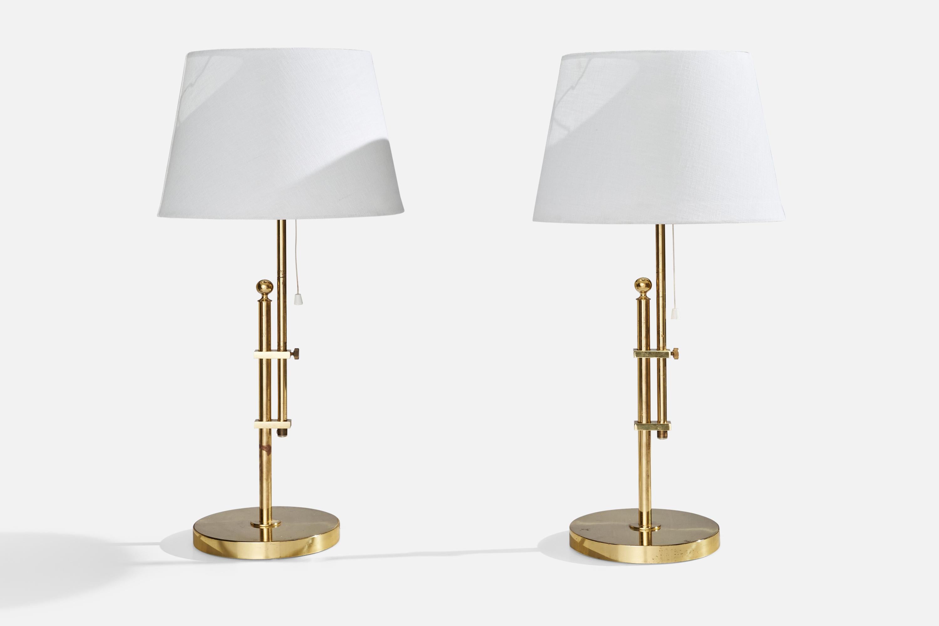 A pair of adjustable brass table lamps designed and produced by Bergboms, Sweden, c. 1980s.

Dimensions variable.
Dimensions of Lamp (inches): 20.5” H x 7.25” Diameter
Dimensions of Shade (inches): 9” Top Diameter x 12” Bottom Diameter x 9”