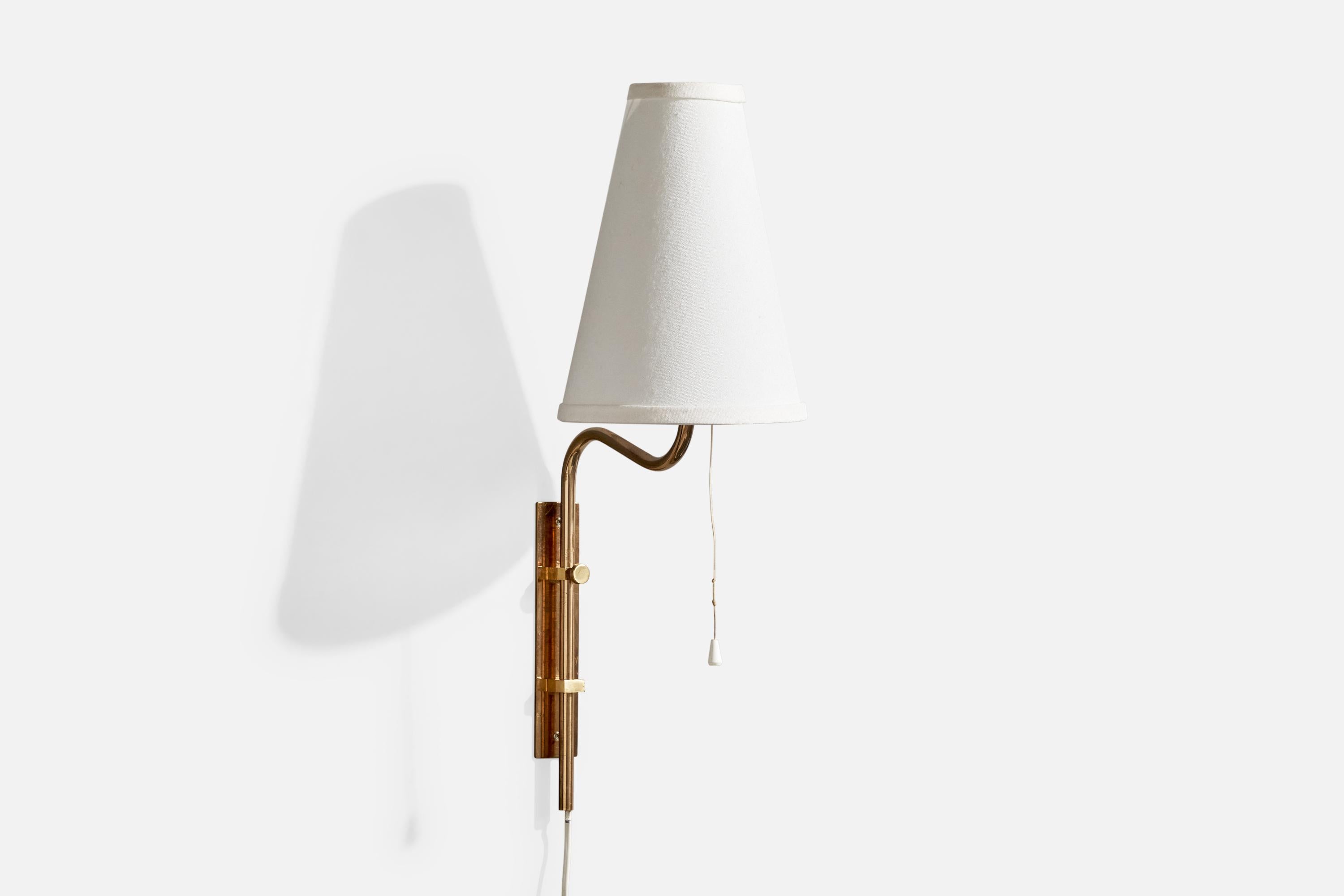 A brass and white fabric wall light designed and produced in Sweden, c. 1970s.

Overall Dimensions (Inches): 22” H x 7.25” W x 10“ D

Back Plate Dimensions (Inches): 7.9” H x 1.6“ W x .5” D

Bulb Specifications: E-26

Number of Sockets (per