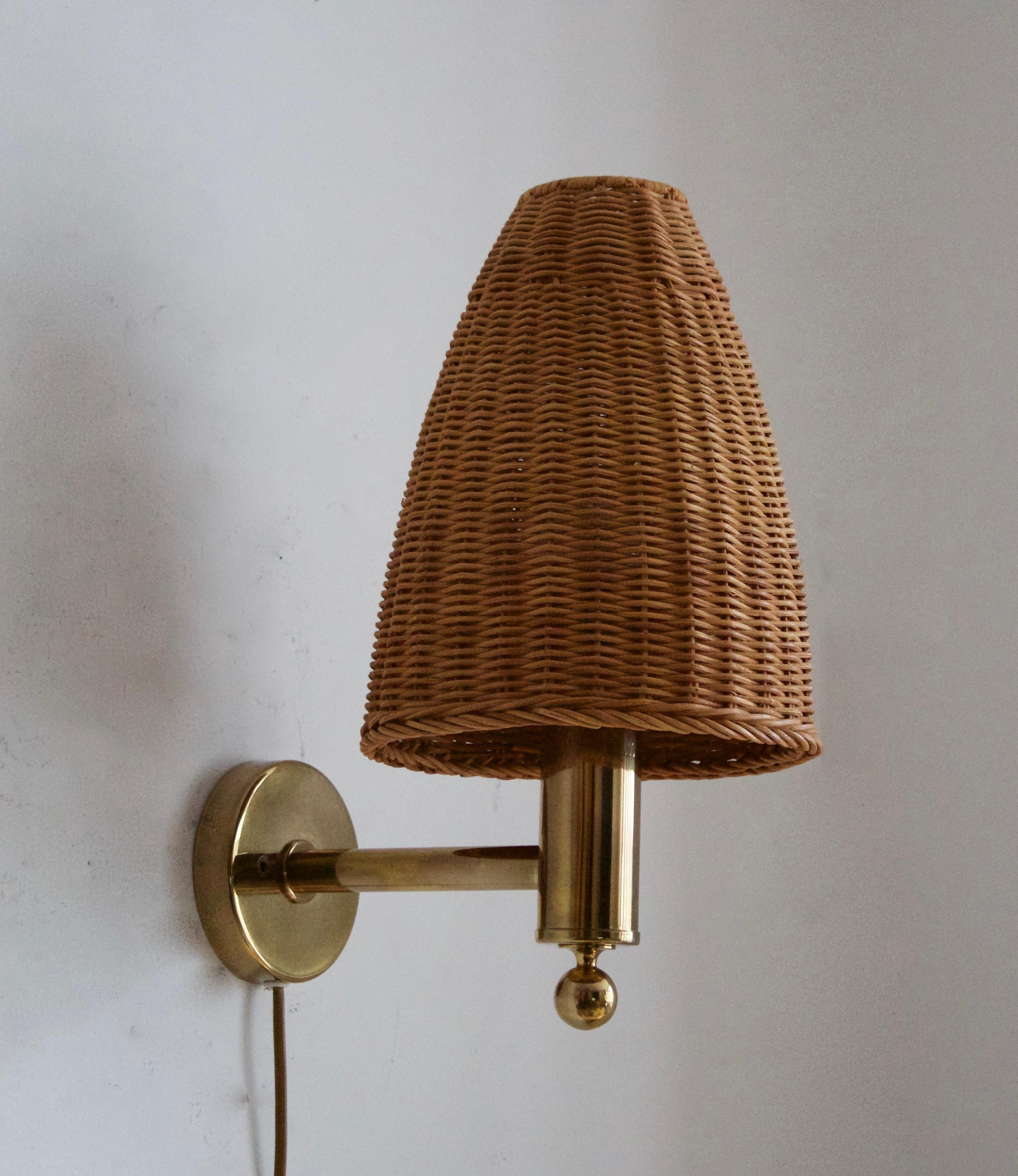 A wall light. Designed and produced by Bergboms, Sweden, circa 1970s. Assorted vintage rattan lampshade.

Other designers of the period include Paavo Tynell, Hans Bergström, Josef Frank, and Kaare Klint.