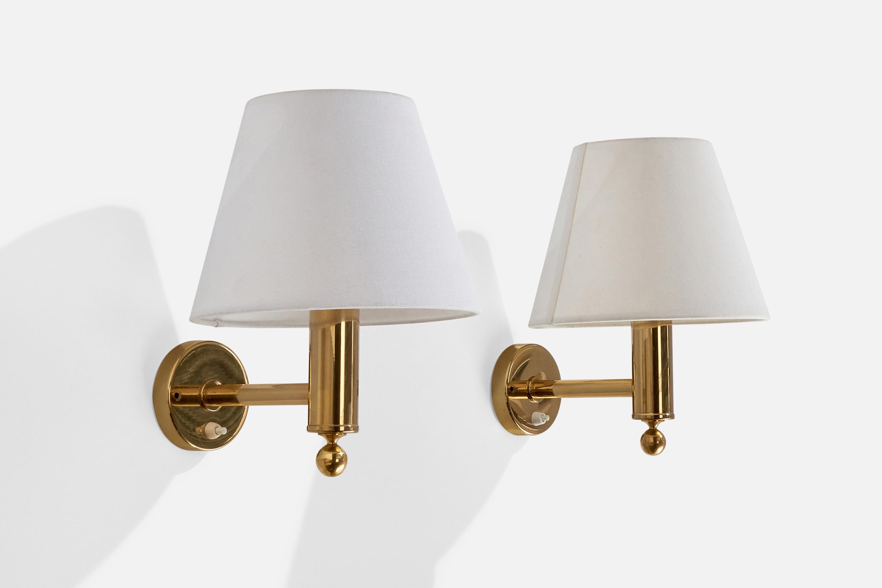A pair of brass and white fabric wall lights produced by Bergboms, Sweden, c. 1970s.

Overall Dimensions (inches):  12.125” H x  9.5” W x  11.5“D
Back Plate Dimensions (Inches):  3.875” H x 3.875” W x .875” D
Bulb Specifications: E-26 Bulbs
Number