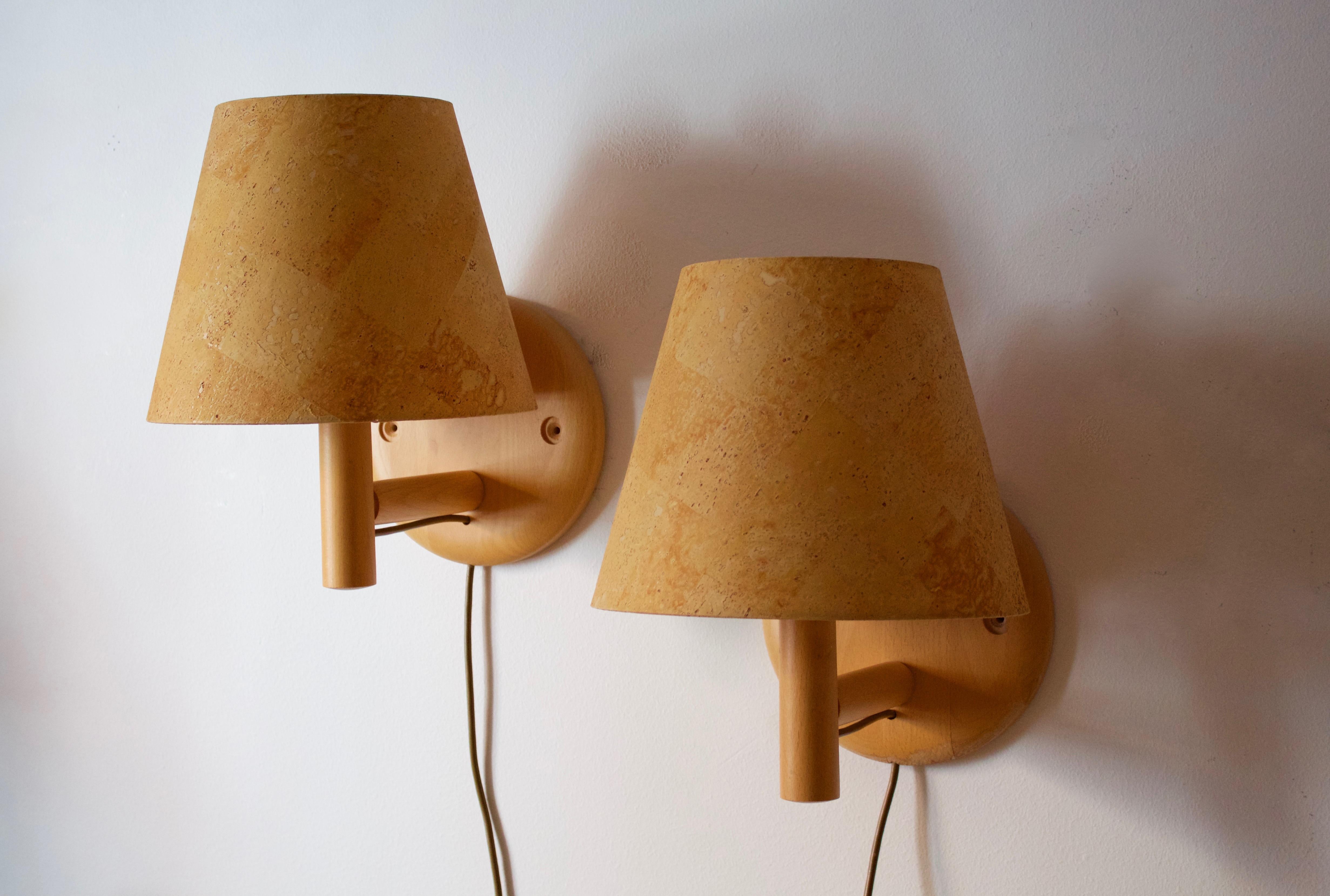 A pair of wall lights / wall sconces. Designed and produced by Bergboms, Sweden, 1960s. Labeled.

Features its original faux cork veneer lampshades.

Other designers of the period include Paavo Tynell, Hans Bergström, Josef Frank, and Kaare