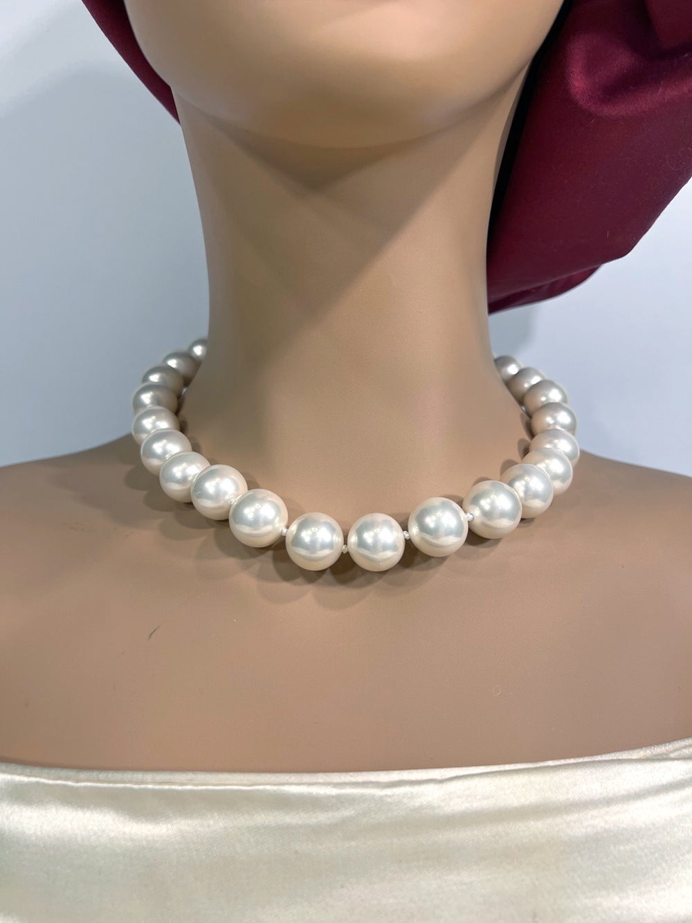 Bergdorf Goodman Mint New Large Faux Pearl Necklace by Clive Kandel

Wonderful, real-looking, superb lustre Japanese man-made faux 16mm South Sea-look pearl necklace, 19 inches long, with a pave CZ vermeil secure ball clasp. 