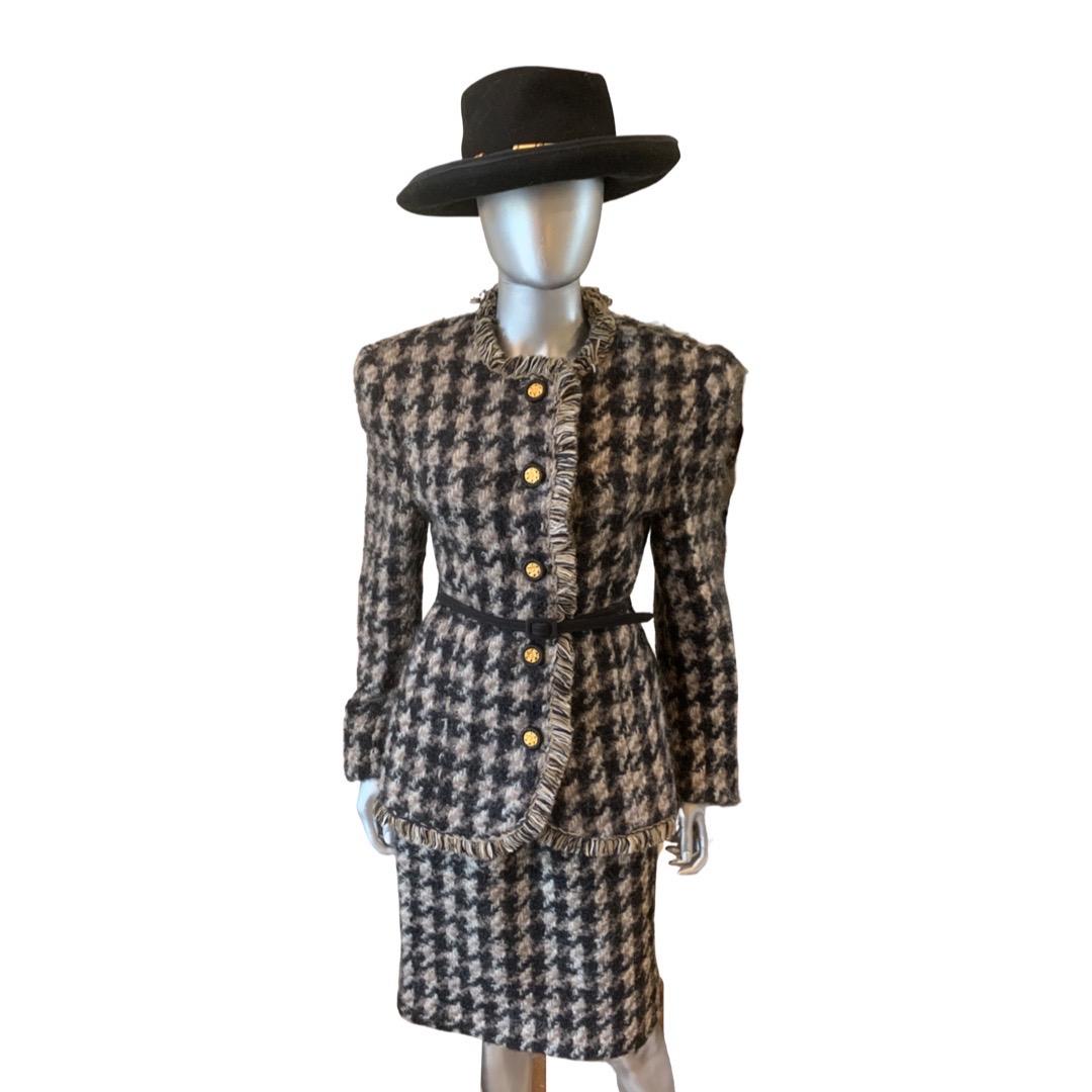 This suit was made in America for Bergdorf Goodman when quality was high and rivaled European couture workmanship. Obviously inspired by a Chanel suit, this mohair brown and black pattern suit. Jacket has beautiful matching yarn fringe trim all