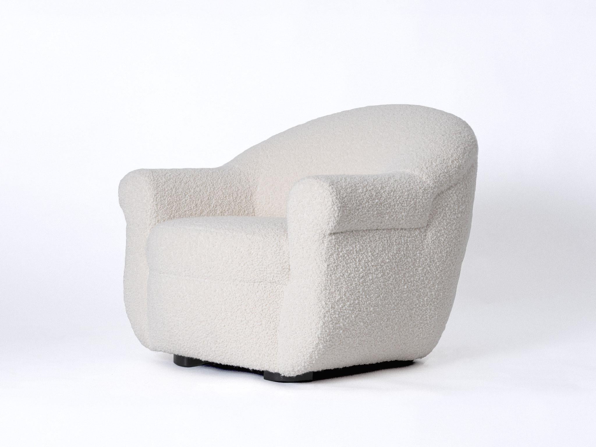 The BERGERE armchair is a timeless and sculptural introduction, distinguished by its graceful lines and welcoming proportions. Plush boucle lends a gentle hand to the low profile of this lounge chair.