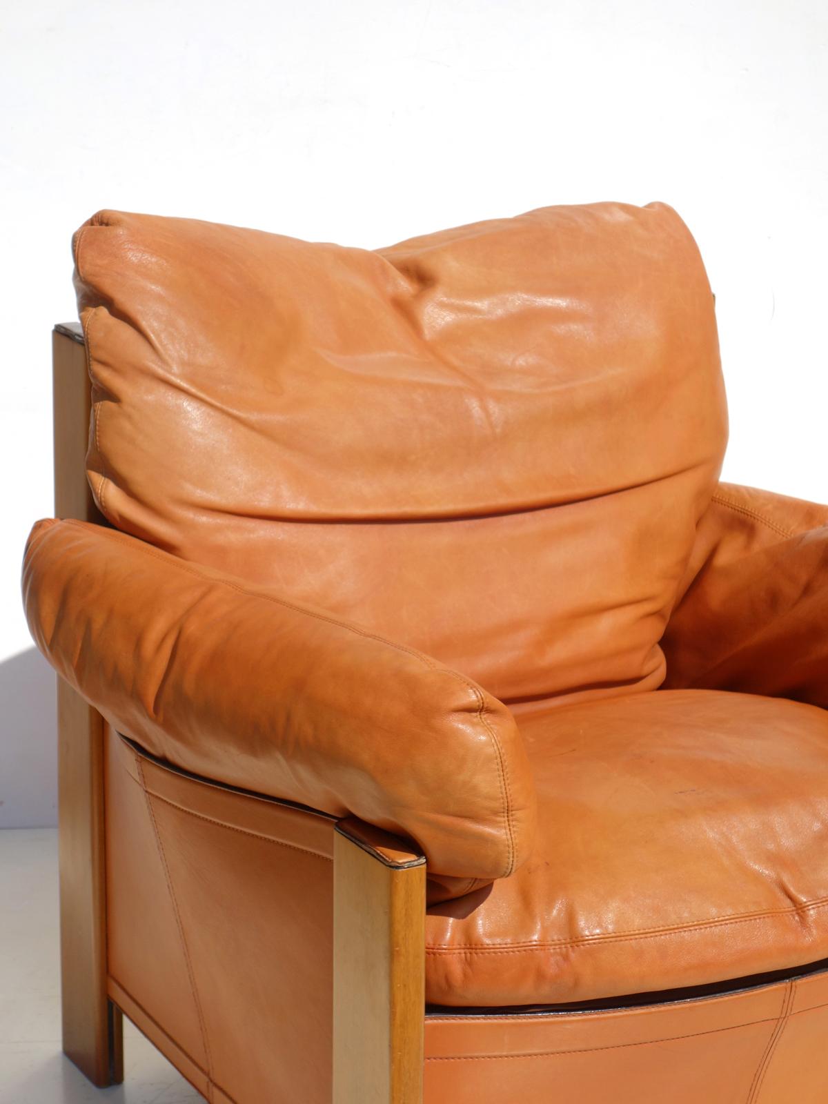 brown leather armchair with ottoman