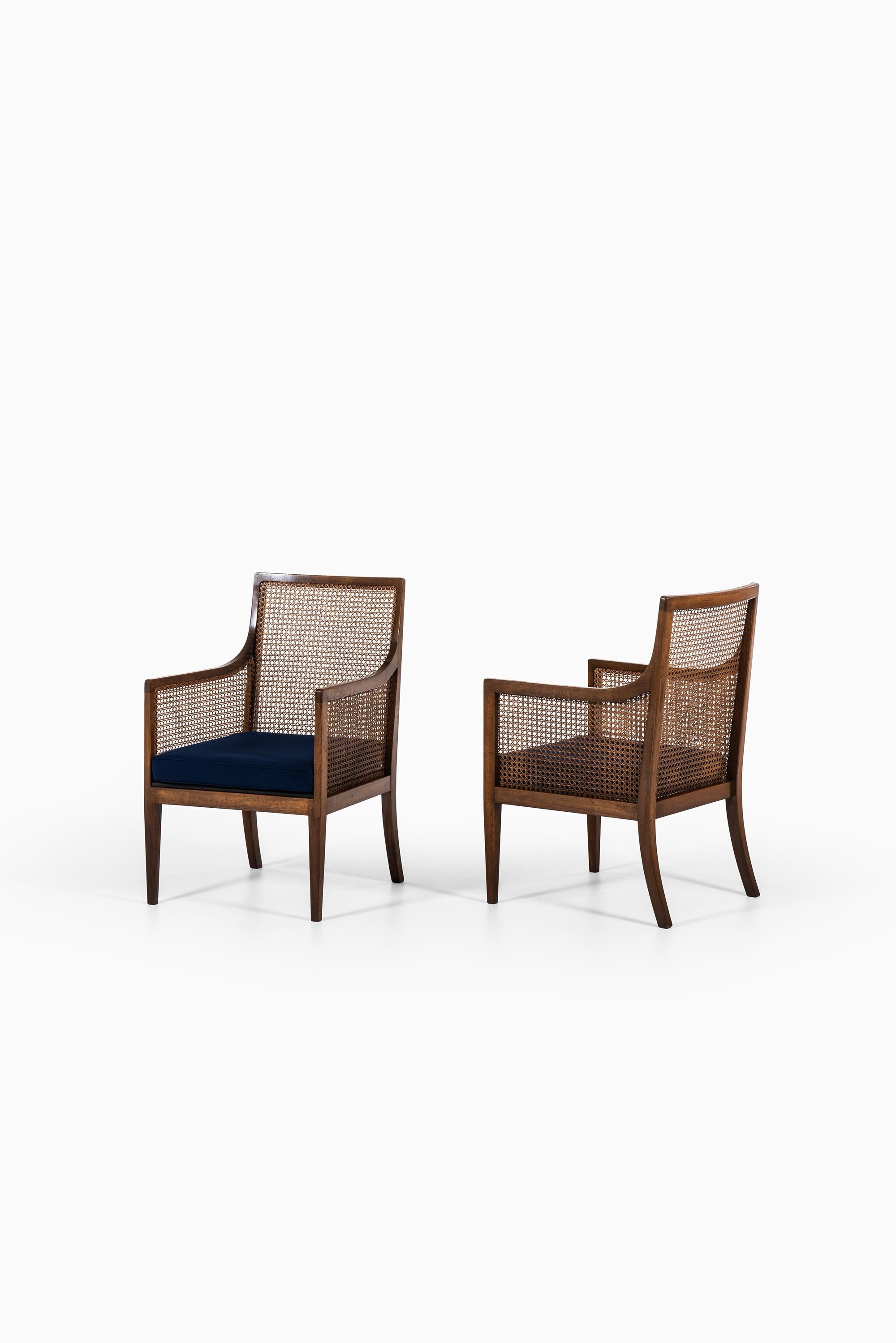 Rare pair of Bergère easy chairs. Produced by Lysberg Hansen & Therp in Denmark.