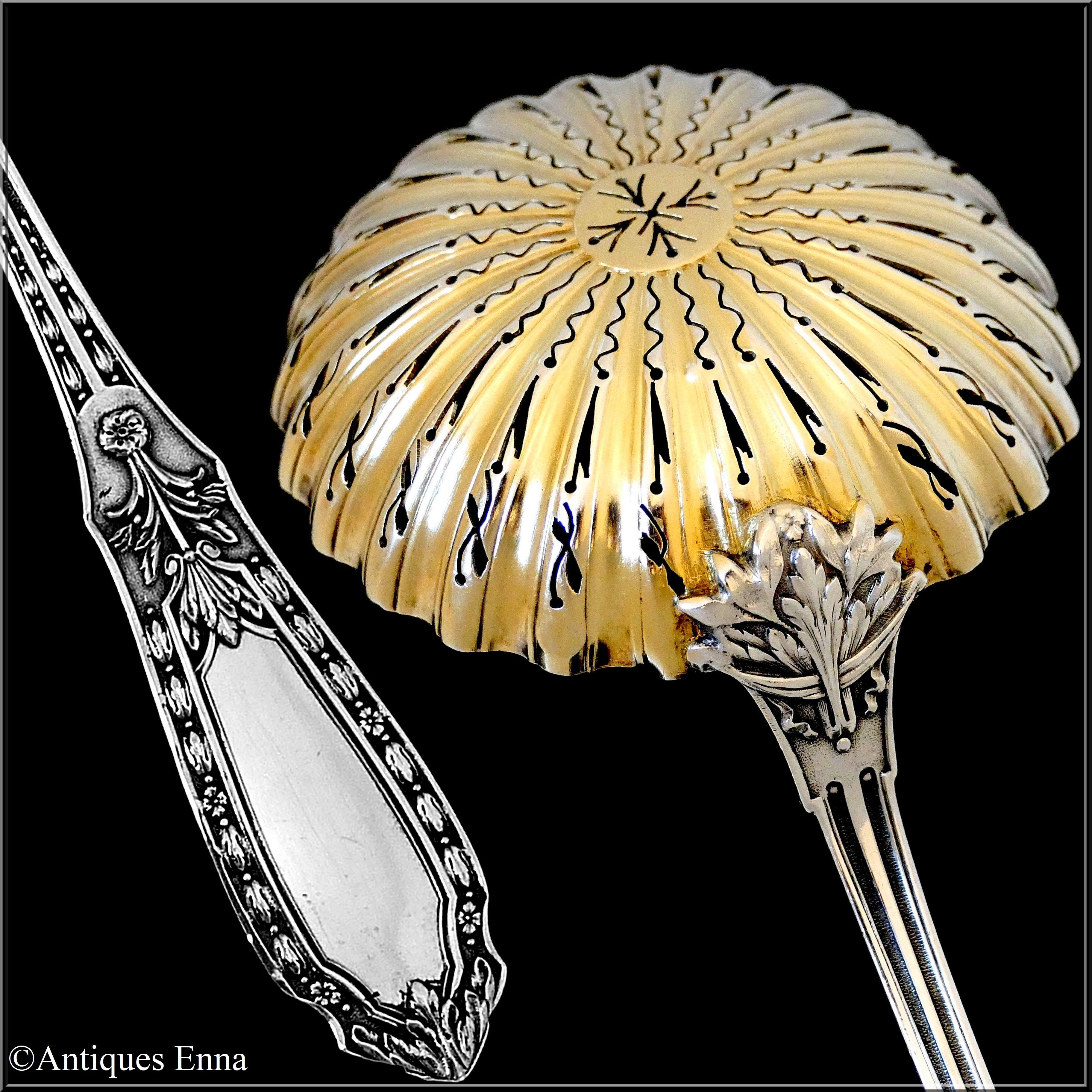 Circular pierced bowl with 18-karat gold finishing, stem and handle with stylized foliate decoration in the manner of Louis XIV, Renaissance. No monograms.

Head of Minerve 1st titre for 950/1000 French sterling silver guarantee. The quality of