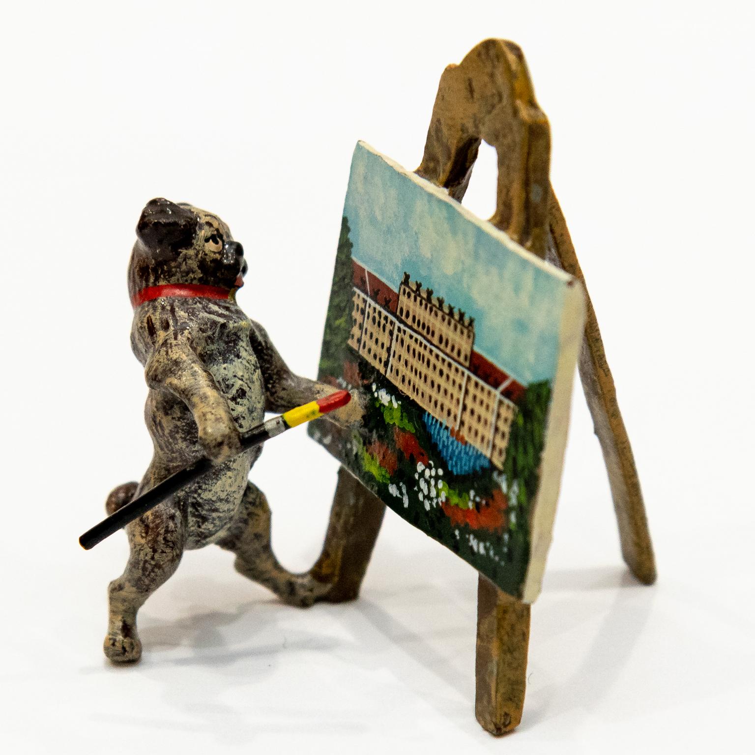 Cast hand painted pug dog with a painting easel. Cold painted bronze Franz Bergmann. Please note of wear consistent with age.

.